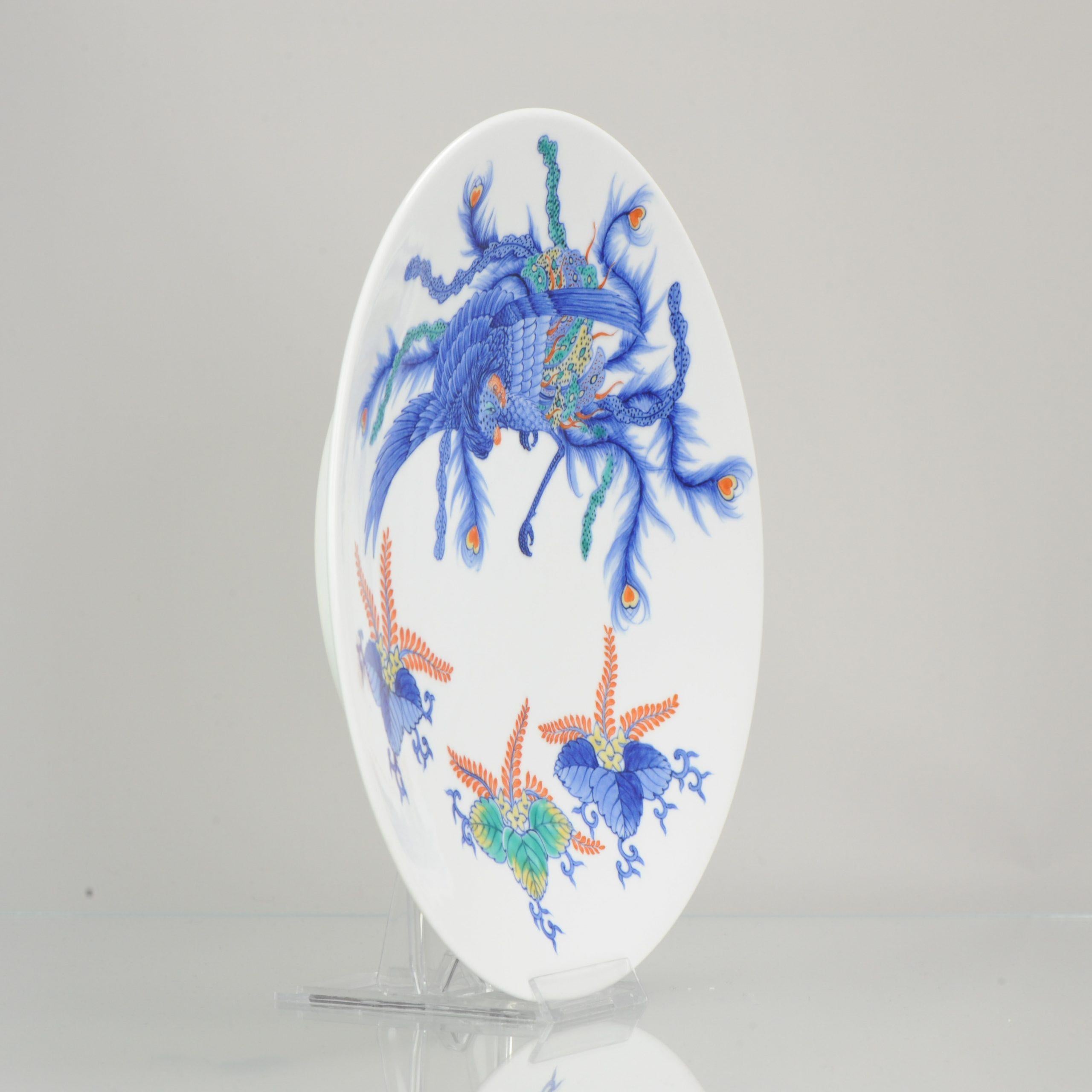 Lovely Japanese Porcelain plate with nice bright coloring and an interestings scene.

Additional information:
Material: Porcelain 
Period: 20th Century
Condition: Overall Condition Perfect
Dimension: Ø 26.7 H cm