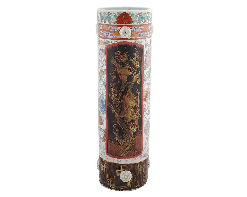 Antique Japanese porcelain umbrella stands adorned with two panels featuring birds and dragons. Japanese porcelain craftsmanship is celebrated for its delicate beauty and attention to detail, making it highly collectible and admired. The depiction