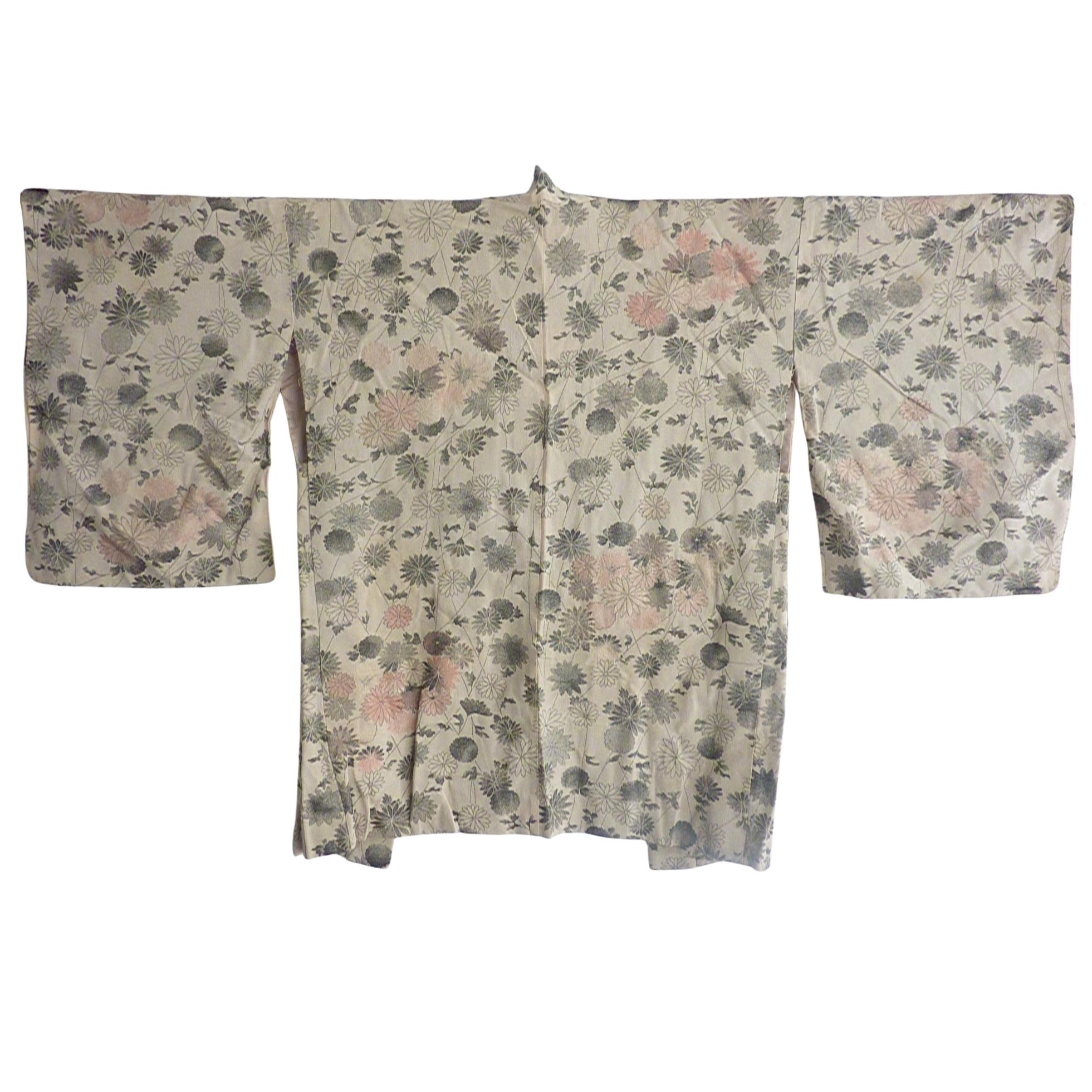 Circa: Meiji
Place of Origin: Japan
Material: Silk brocade with silver threads.
Deep sleeve drops.
Condition: Very good
Some loose threads and age spots. Will leave it to new owner to refresh.
Total length 38