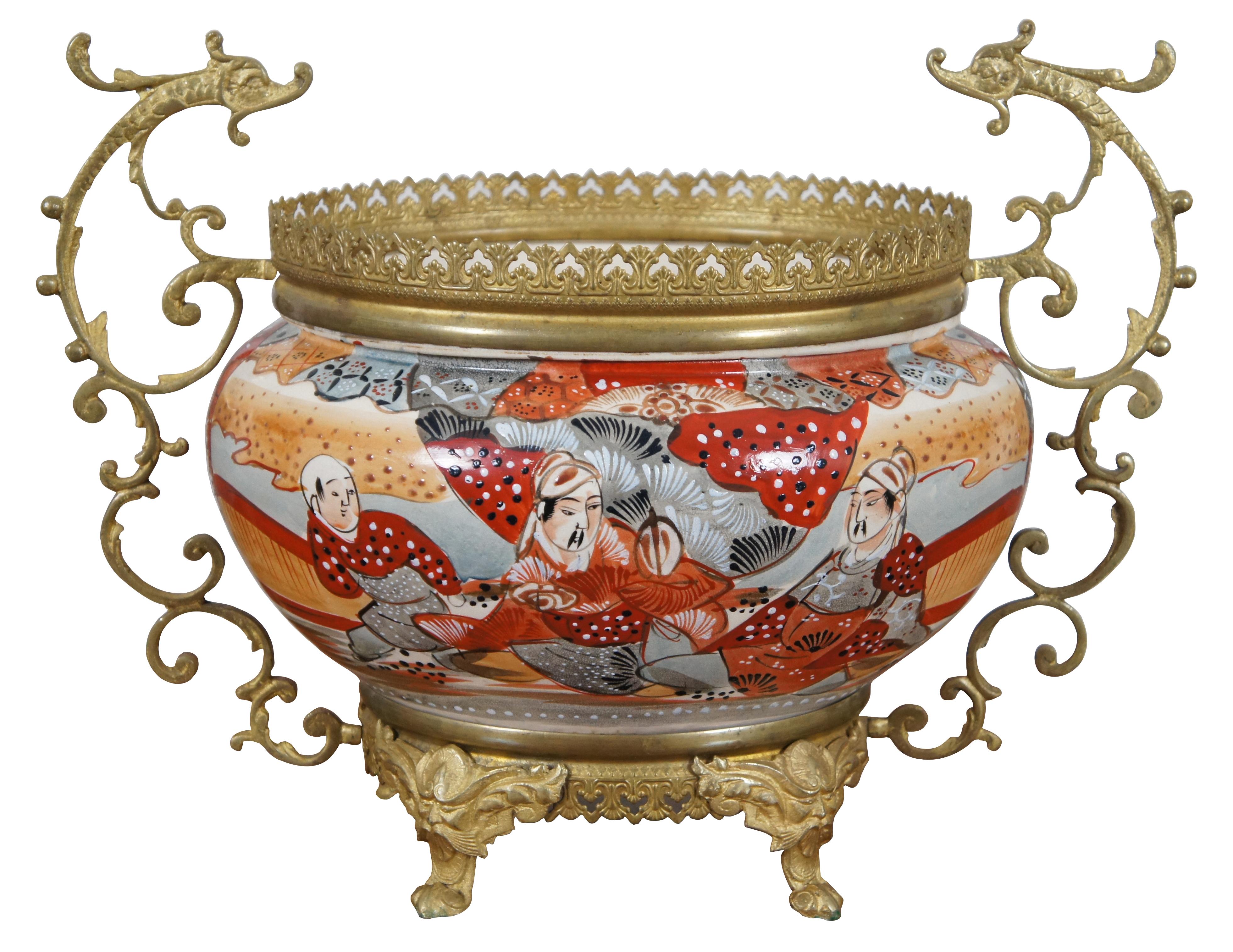 Rare antique parlor set of Japanese Satsuma porcelain and brass Kosmos Brenner oil lamps and jardinière / cache pot / planter / urn. Both are moriage painted with red, orange, gray and white figures and designs. The bases of the ginger jar shaped