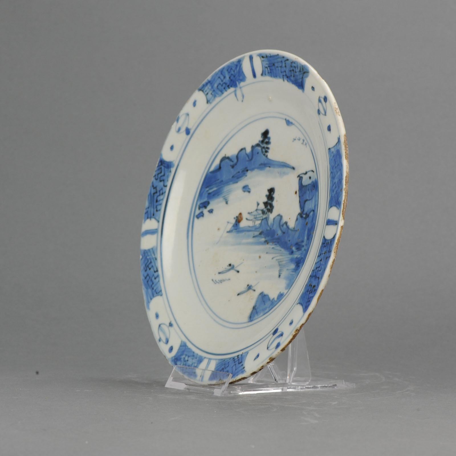 A rare Shoki-Imari porcelain dish, Arita Kilns circa 1630-1640. This flat dish with everted rim and its thick rough foot-rim is typical of some of the earliest Japanese porcelain ever produced. The dish is thickly potted and the glaze crazed, both
