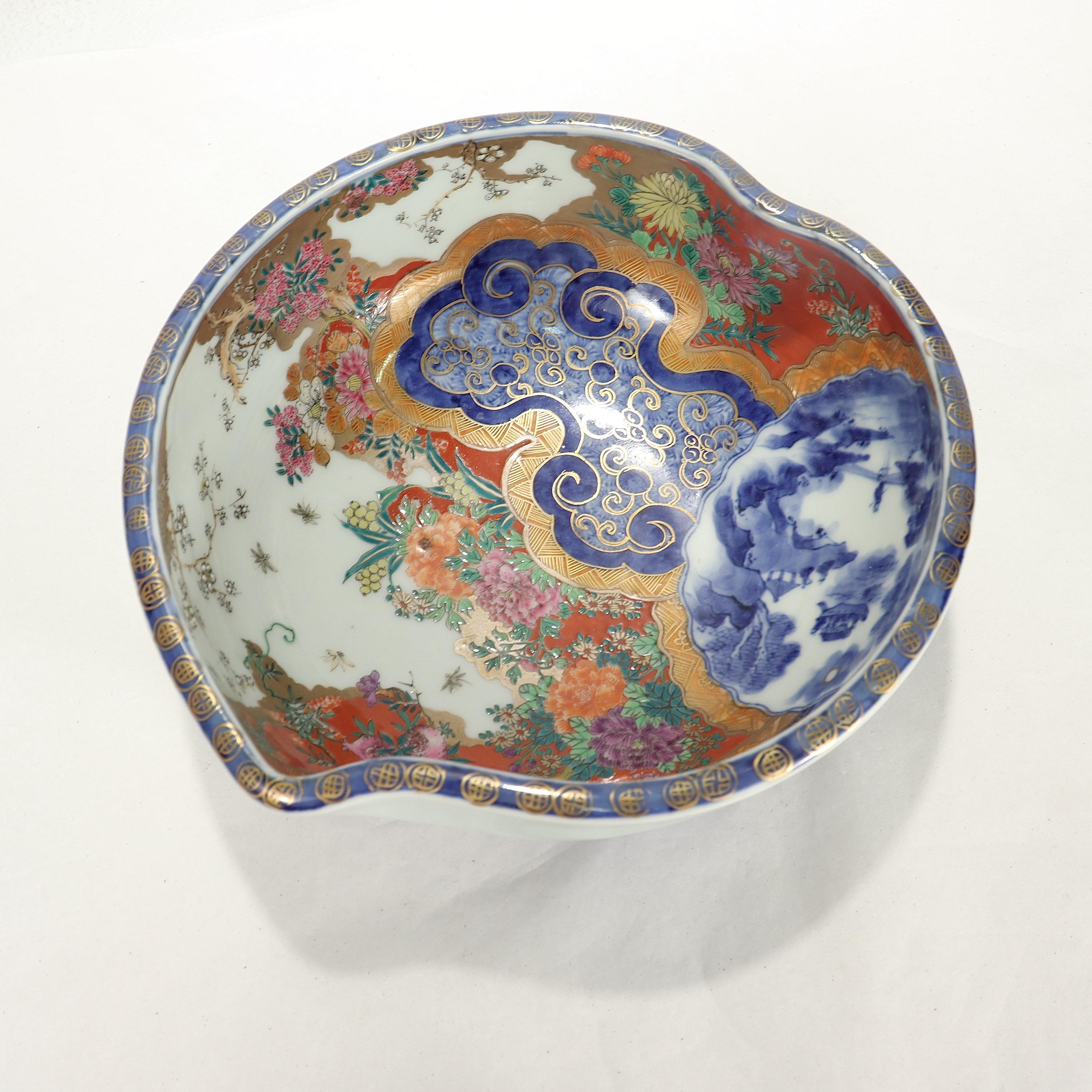 A fine antique signed Japanese Imari porcelain bowl.

In the form of a shaped bowl with a plum-like shape.

Decorated throughout with exquisitely detailed painted or enameled decoration, blue underglaze decoration, and extensive
