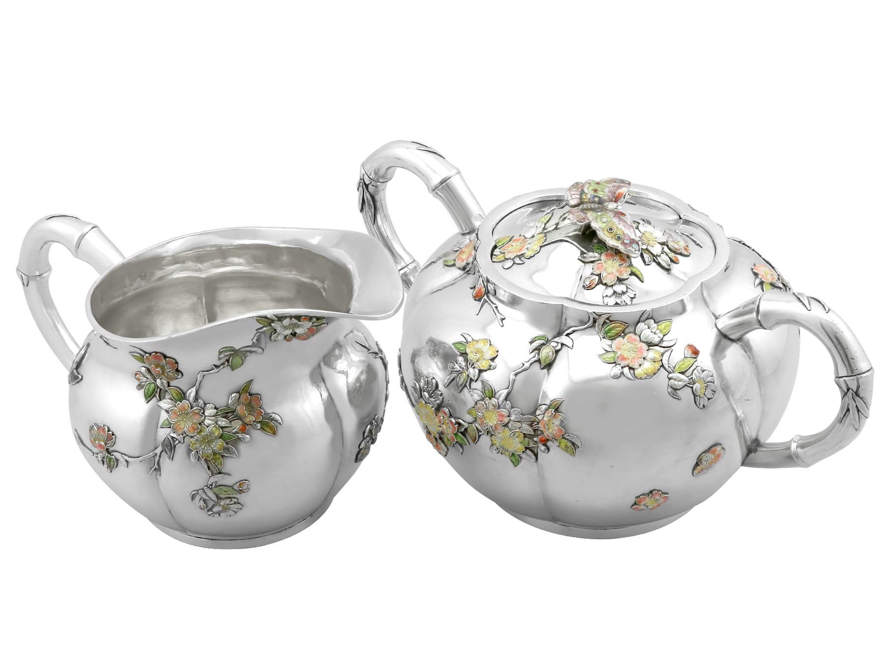 An exceptional, fine and impressive antique Japanese silver and enamel cream jug and sugar bowl set; part of our Japanese silverware collection.

This exceptional antique Japanese silver cream jug and covered sugar bowl have a circular