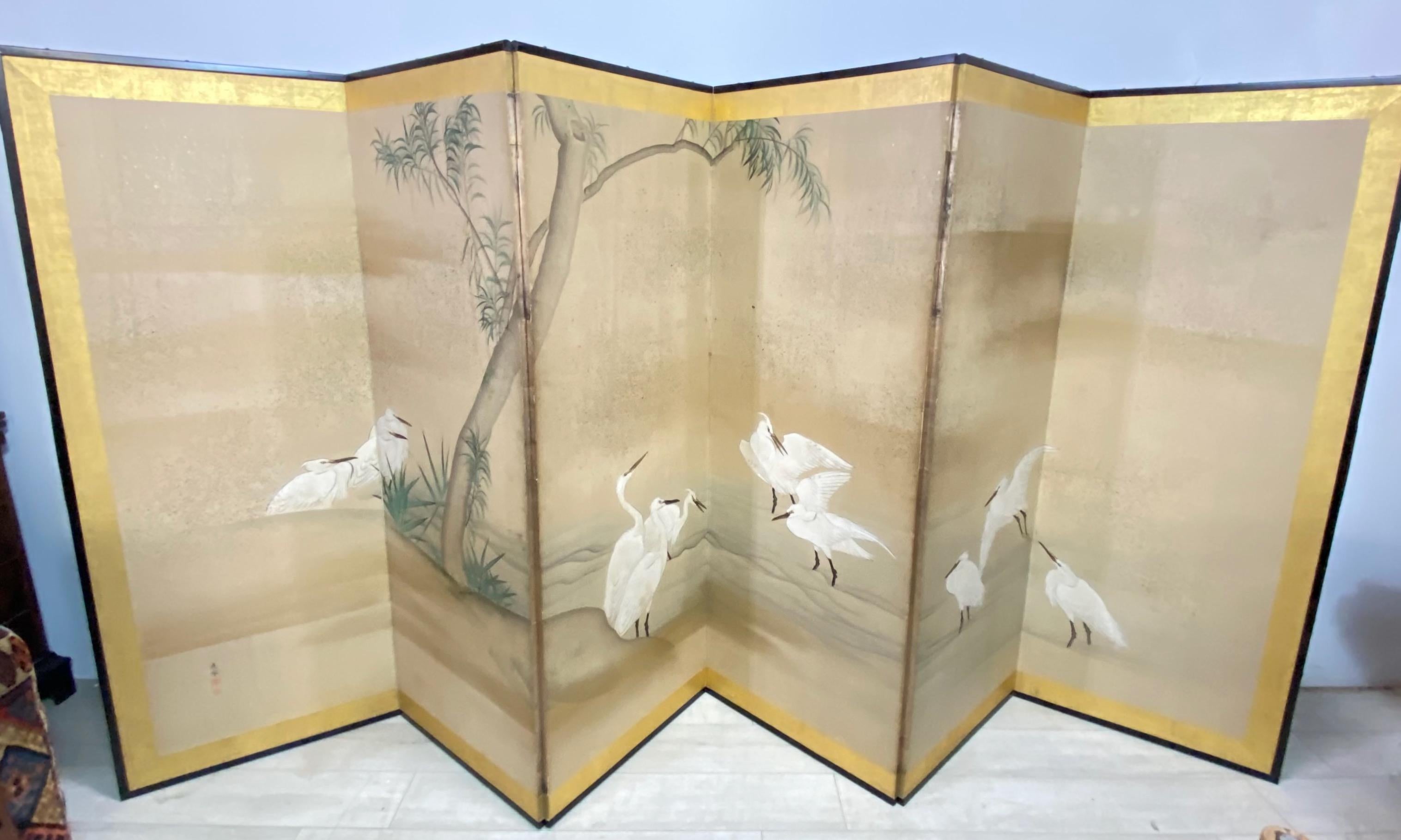 Japanese six panel folding screen, hand painted in mineral pigments on mulberry paper in a black lacquer wood frame. Water scene with graceful white cranes.
Meiji period, circa 1900.
Late 19th - Early 20th century.
Minor light signs of age,