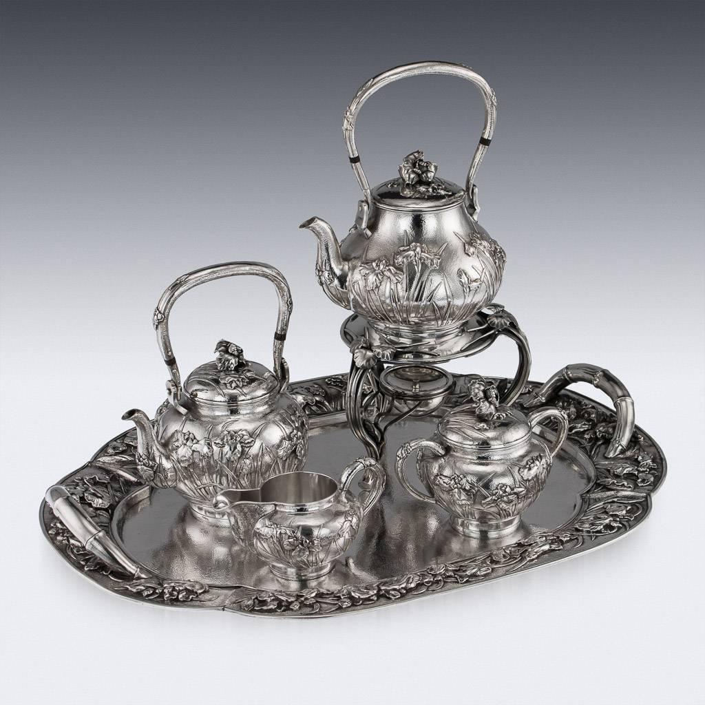 Antique early 20th century Japanese Meiji period solid silver four-piece tea service on tray, consisting of a tea kettle on stand, teapot, covered sugar bowl, cream jug and tray, exceptional and magnificent quality, double walled, embossed and