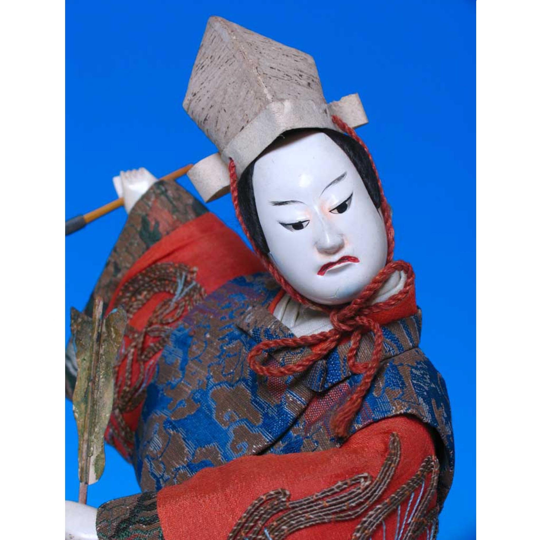 Japanese Takeda Ningyo, depicting  a kabuki actor on the stage, dressed in kinran dragon & cloud brocade coat with sleeves thrown back, chirimen silk crepe sleeves of inner coat embroidered in a couched gold wrapped thread dragonfly design popular