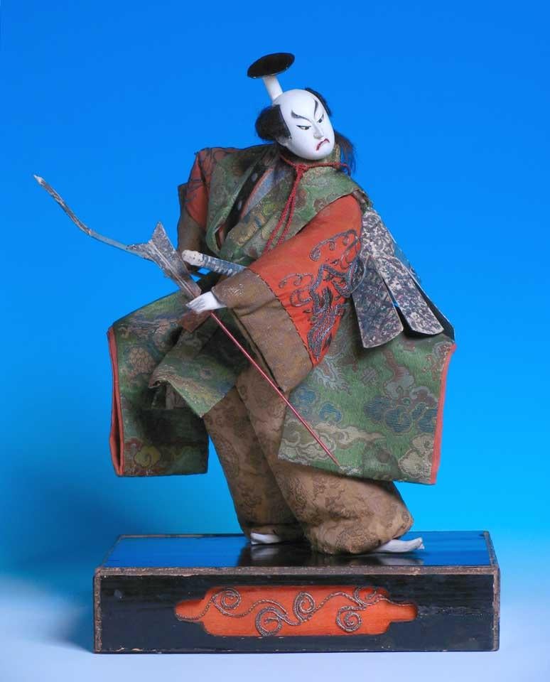 Japanese Takeda Ningyo, depicting  a kabuki actor on the stage possibly in the role of Soga no Goro Tokimune, dressed in kinran dragon & cloud brocade textiles and chirimen silk crepe sleeves embroidered in a couched silver wrapped thread rock &