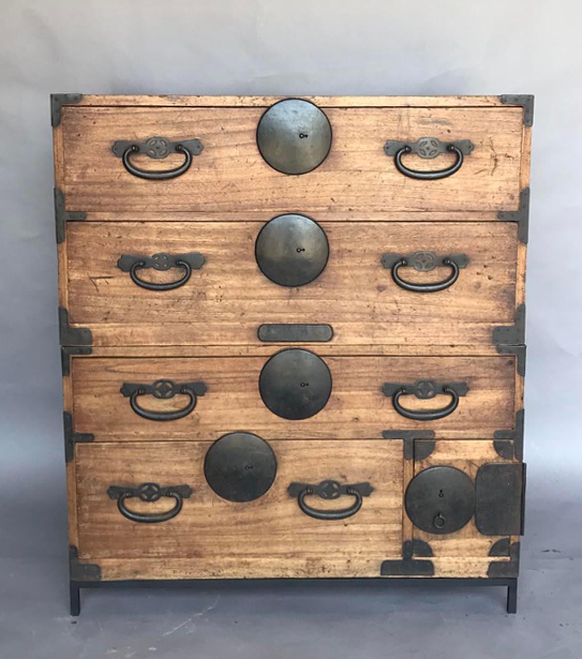 Very functional, hinoki wood Japanese tansu on custom iron base. This tansu has four drawers and one small compartment with two small drawers. All original. Works as a chest of drawers or can be separated and used as nightstands or side tables.