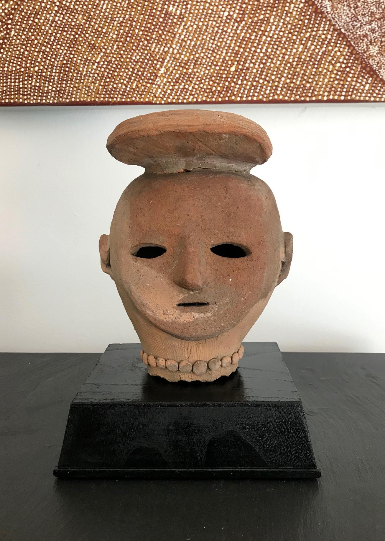 On offer is a rare Haniwa (??) figure head from Kofun Period (3rd to 6th Centuries AD). The Haniwa figures are made from terracotta clay for ritual use and funerary objects, and they created according to the wazumi technique, in which mounds of