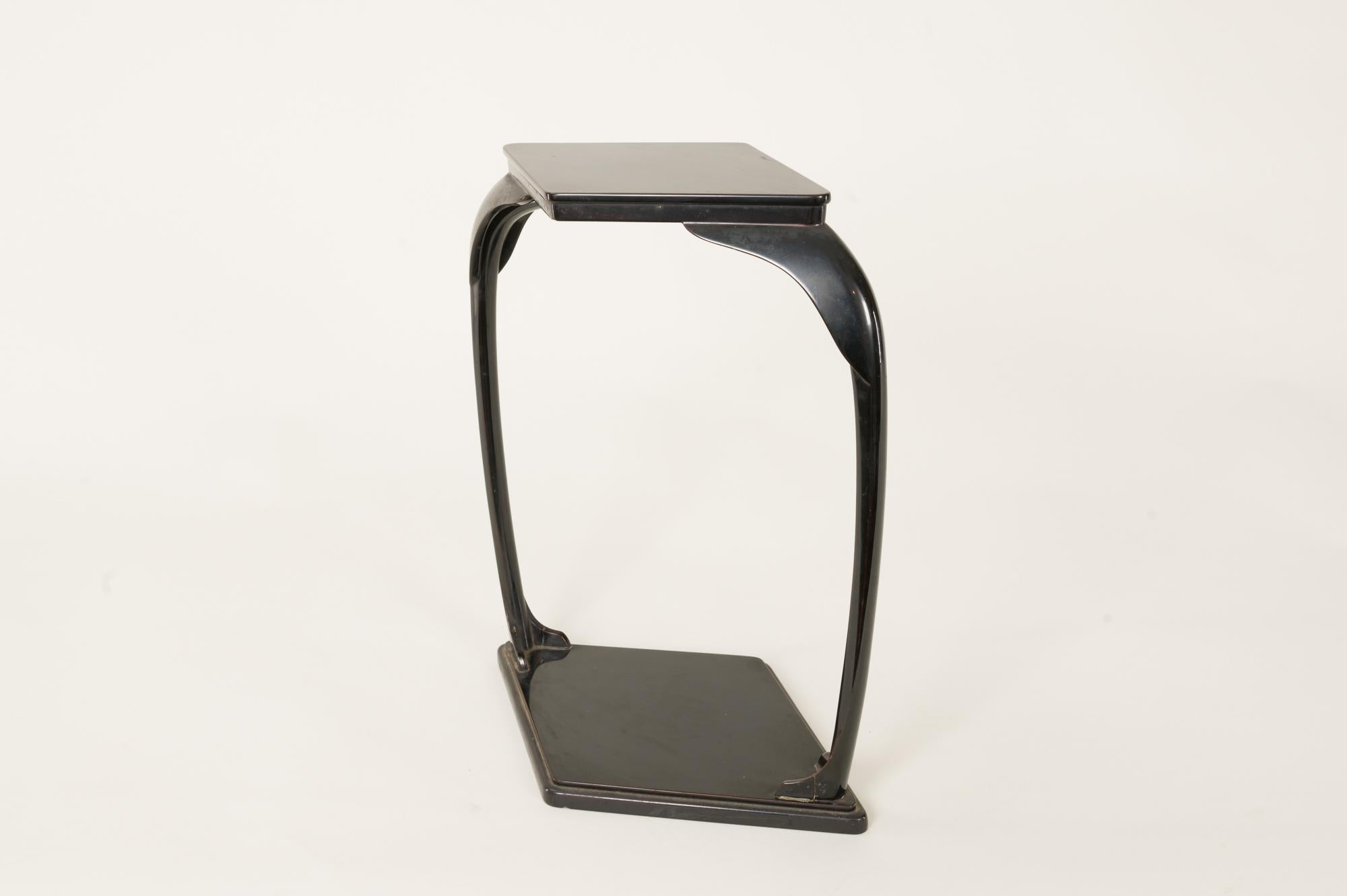 Originally made for presenting a small treasure, this stand has a diamond shape and is made of characteristic Japanese deep black lacquer with brown tones.