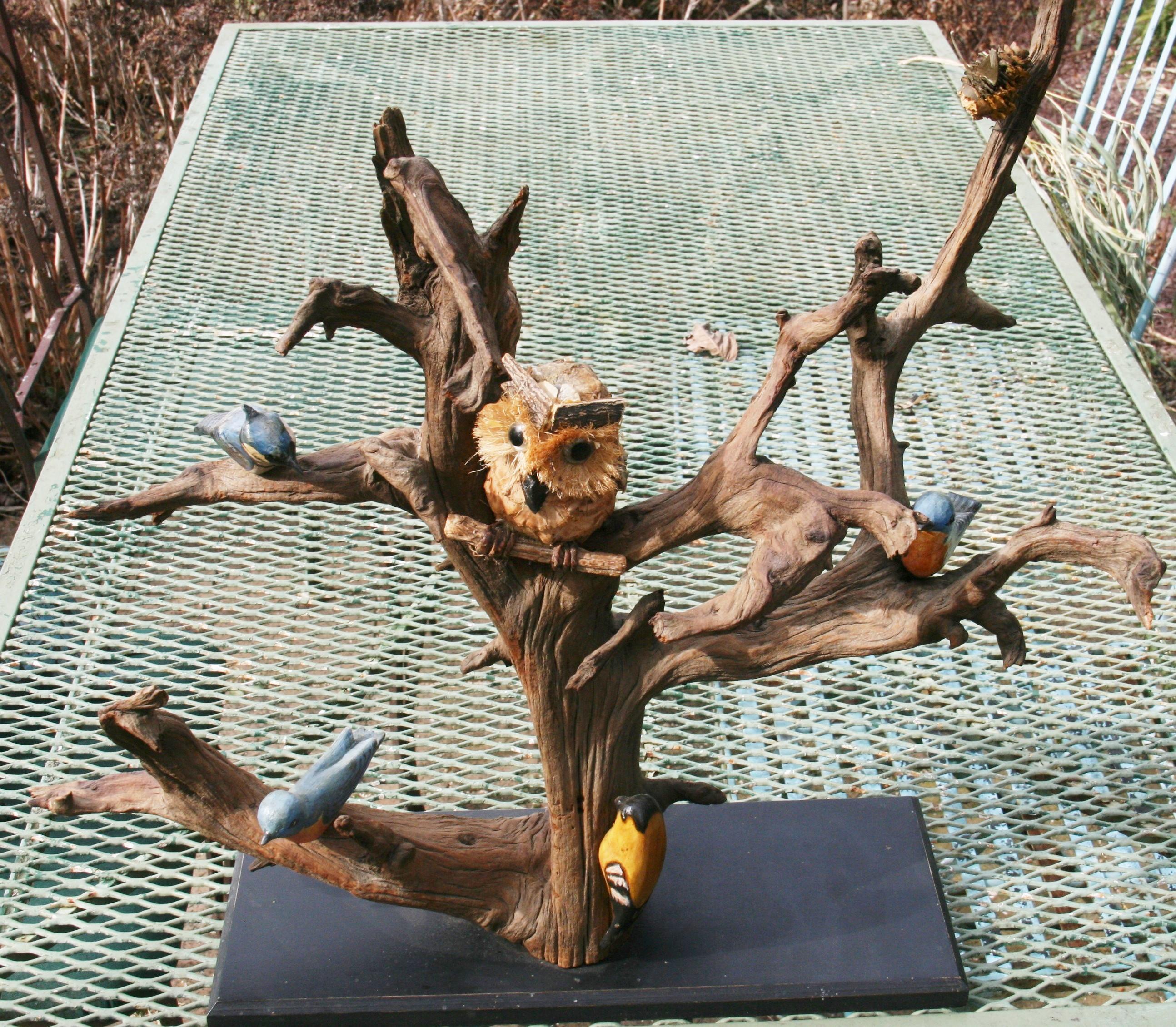 An early twentieth century American whimsical folk art bird tree  driftwood hand carved and painted  bird sculpture.
Small owl a later addition.