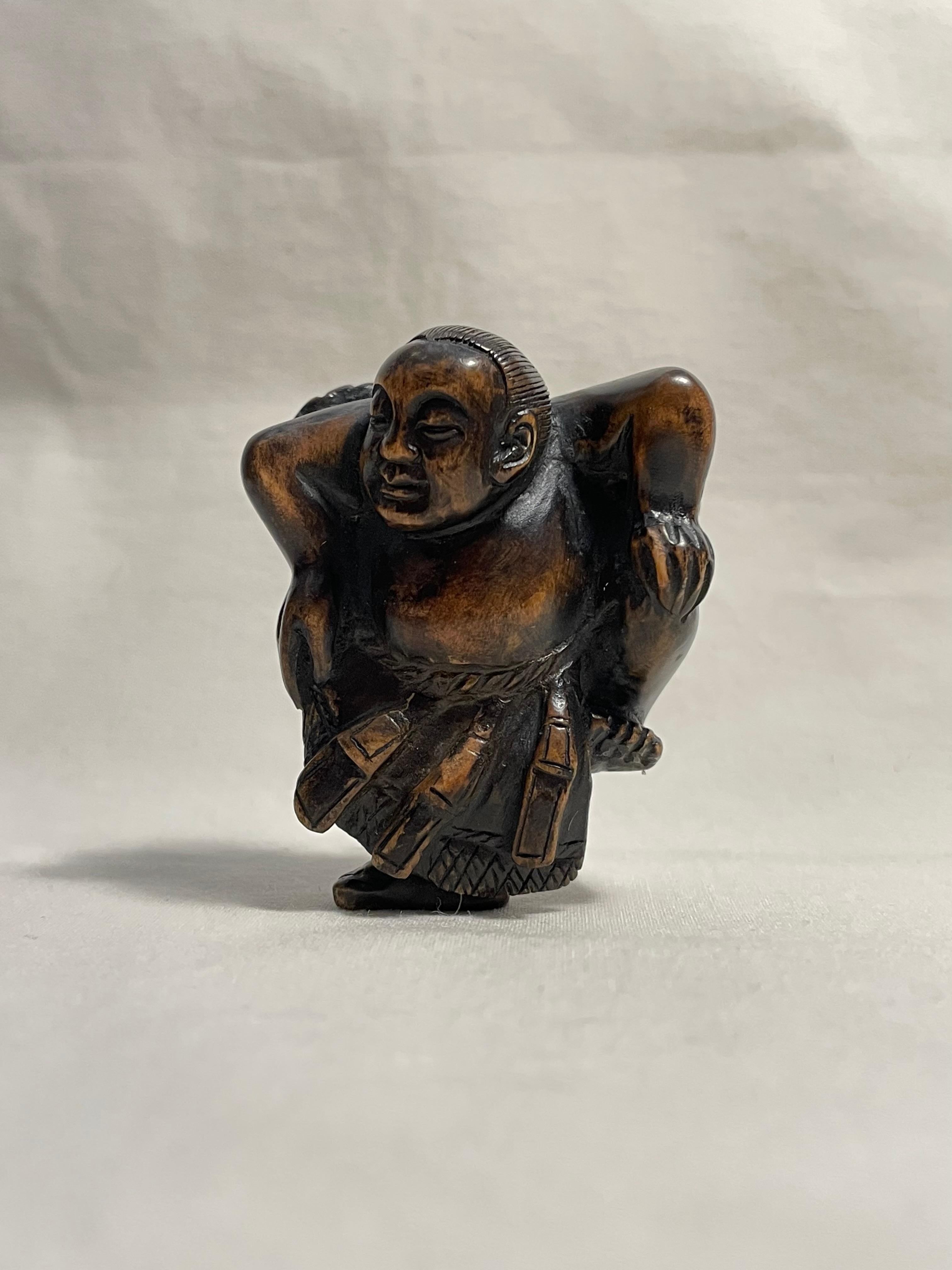 This is an antique netsuke made in Japan around meiji period 1900s.
This netsuke was made by a netsuke artist 'Hironaka' (you can see his signature on the right feet of this sumo wrestler.)
Netsuke is a miniature sculpture, originating in 17th