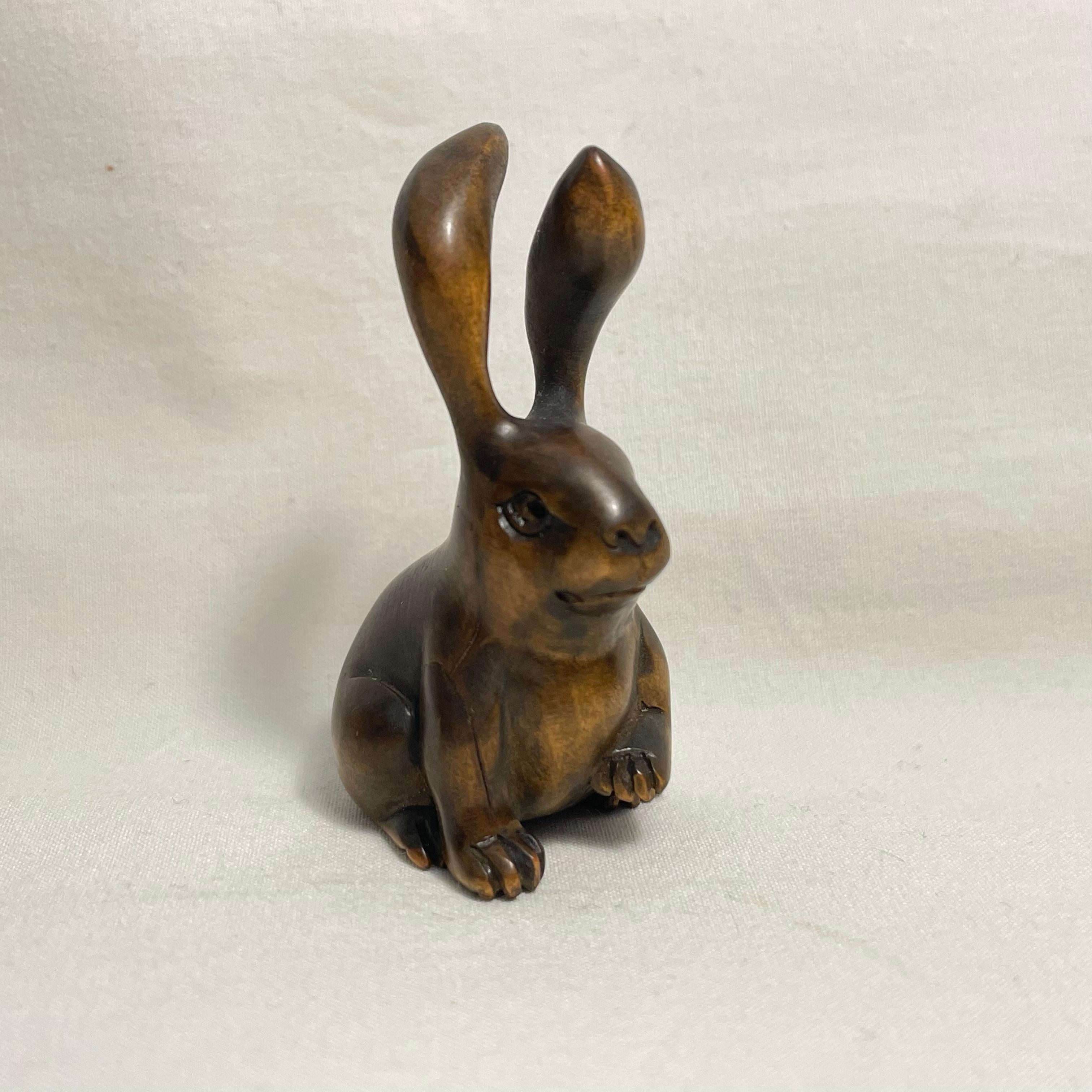 This is an antique wooden netsuke made in Japan around Meiji period 1900s.
The signature is written on the back side 'Gyokuseki'.

Netsuke is a miniature sculpture, originating in 17th century Japan.
Initially a simply-carved button fastener on the