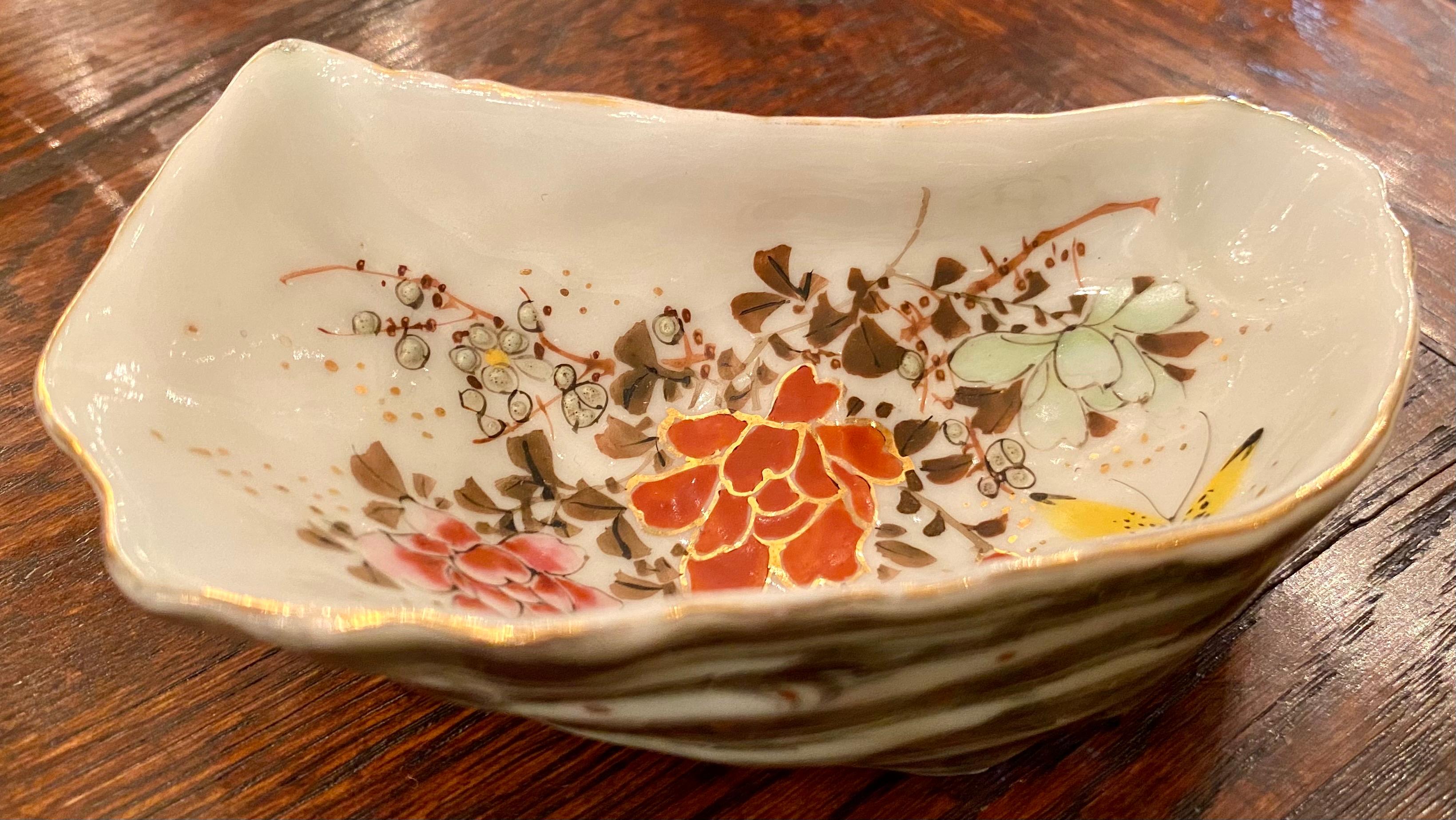 Antique Japanese hand painted Kutani porcelain oyster shooter with yellow butterfly and flowers, circa 1890.
All individually hand-painted in various colors and motifs.
   