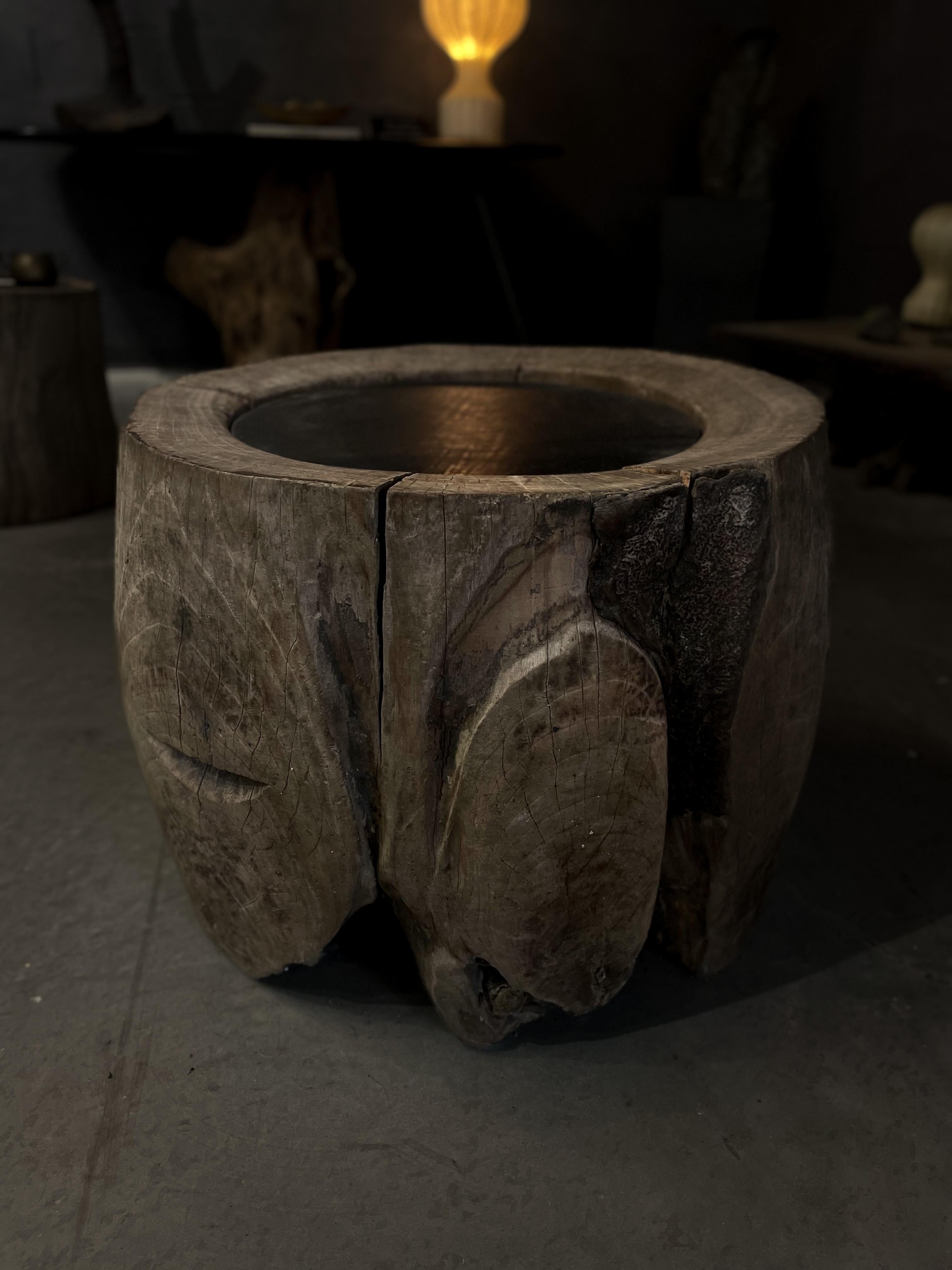 This Japanese coffee table is composed of an antique base made from an ancient Japanese Zelkova wood Usu . The natural texture and patina give this piece an earth feel that one can usually only find in nature. The piece is completed off by a new