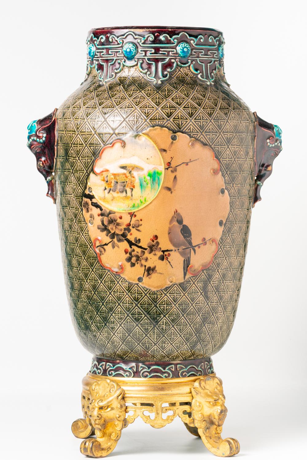 This impressive and large French vase was realised in Bordeaux by the worldwide renowned Jules Vieillard & Co and dated between 1880-1895 when the ceramic company's favourite designs and techniques were developed. This bulbous cylindrical vase has