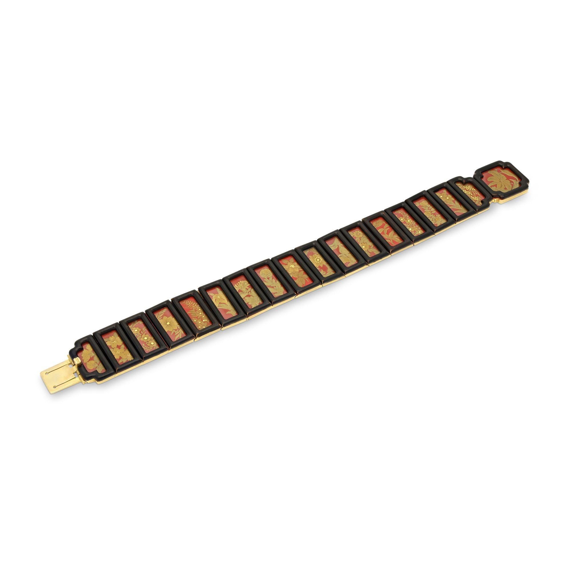 Summary:
Antique Japonisme Red Ground, Gold & Enamel Bracelet
Description:
An Art Deco red lacquer, gold and black enamel floral motif bracelet. The articulated bracelet is composed as a series of eighteen Japanese panels bordered with black enamel,