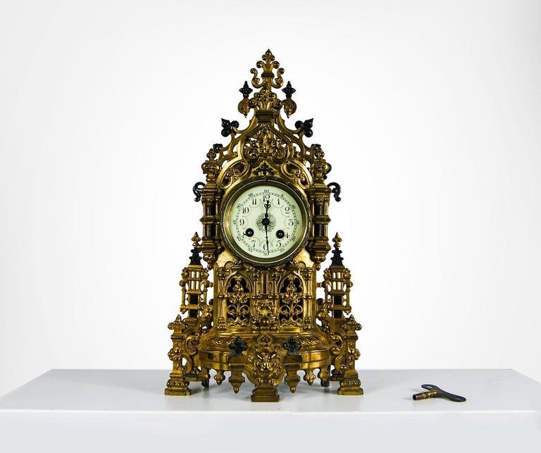 Exceptional 19th century Japy Frere France mantle clock and matching garnitures set.
Made of enamelled brass.
Impressive mantle set, with intricate gothic swags highlighted in black champlevé enamel, along with a lion head and lion claws
