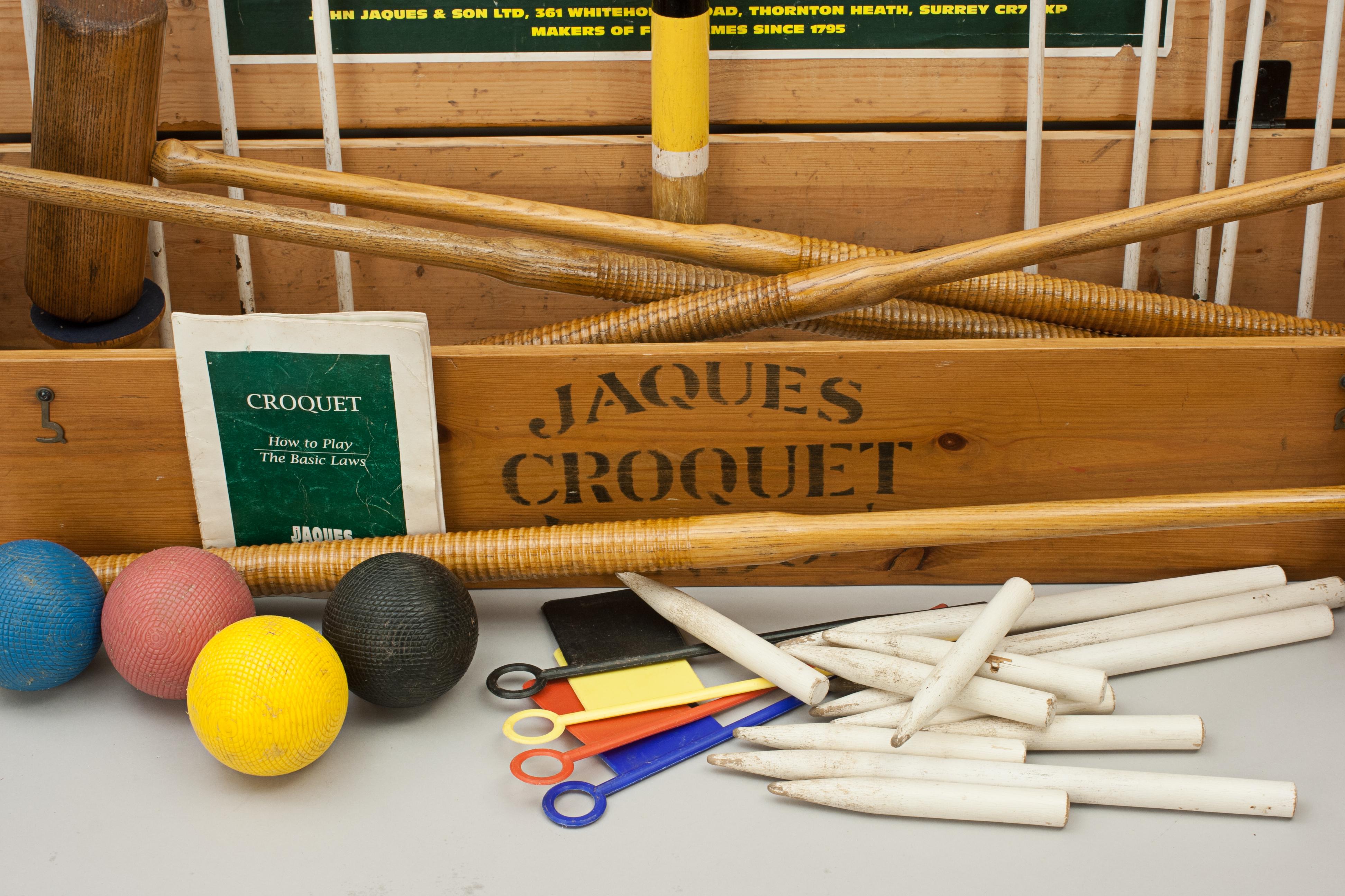 Jaques 'Corrigrip' croquet set.
A Jaques garden croquet set in original pine box with four ash mallets. To complete the set there are four coloured balls in the standard croquet colours, six bent metal hoops, 4 sprung clips, four coloured plastic