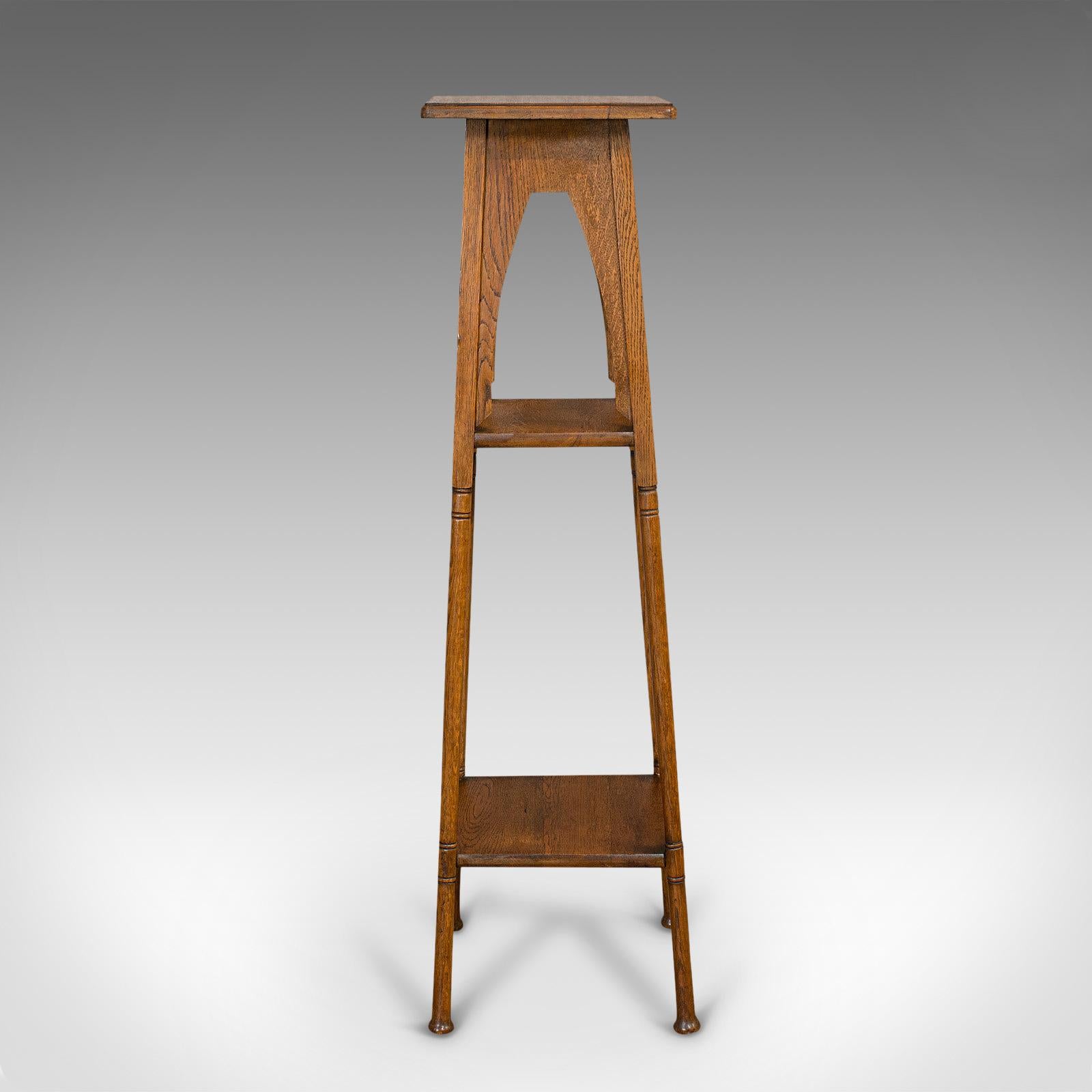 This is an antique jardinière. An English, oak plant stand with Liberty-esque Arts and Crafts taste, dating to the late 19th century, circa 1900.

A wonderfully presented stand
Displays a desirable aged patina
Select oak shows fine grain