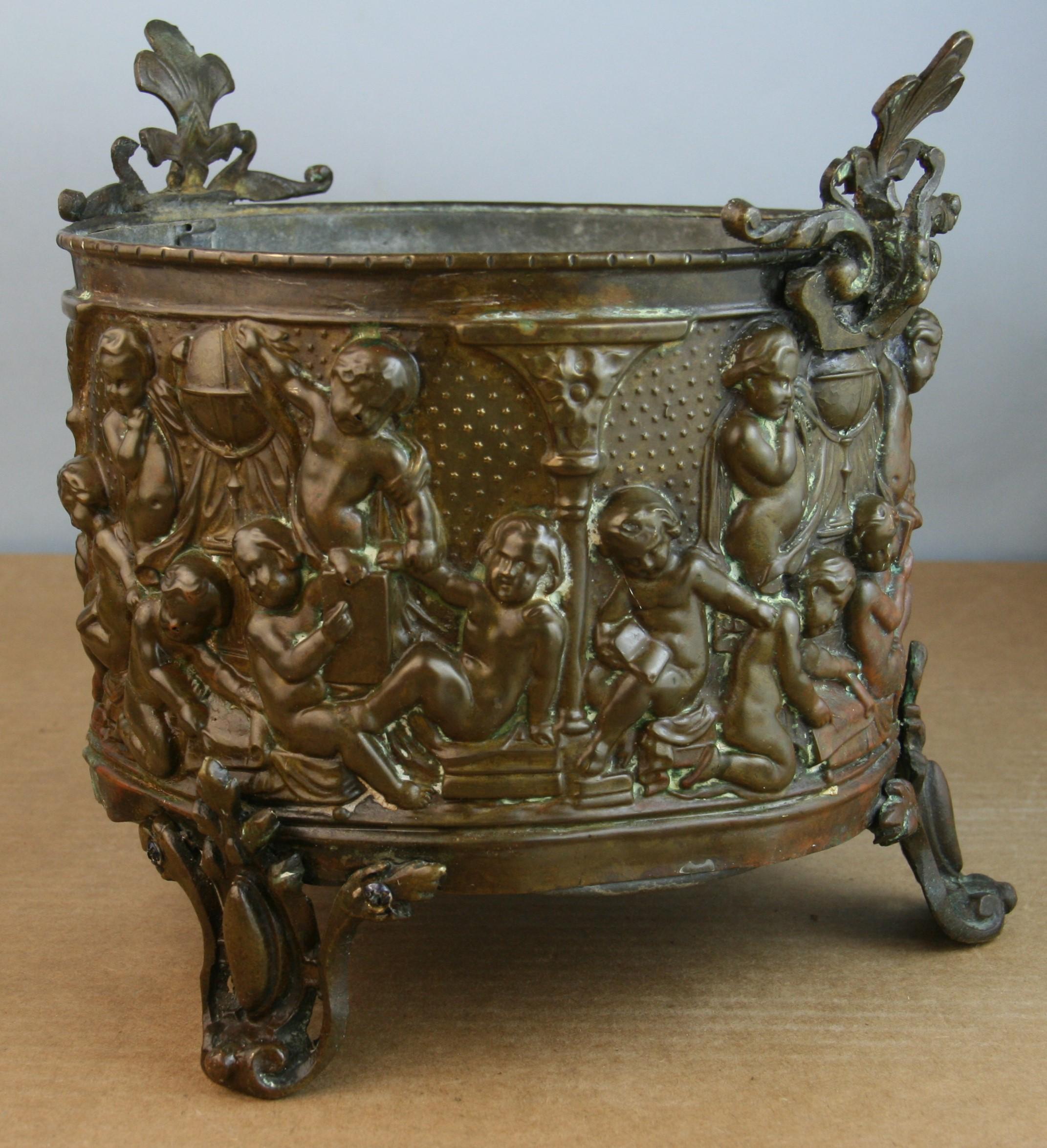 Hand Crafted and highly decorative Renaissance Revival copper planter
The piece has amazing patina and the zinc liner is still inside.
The zinc liner has one hole on the bottom.