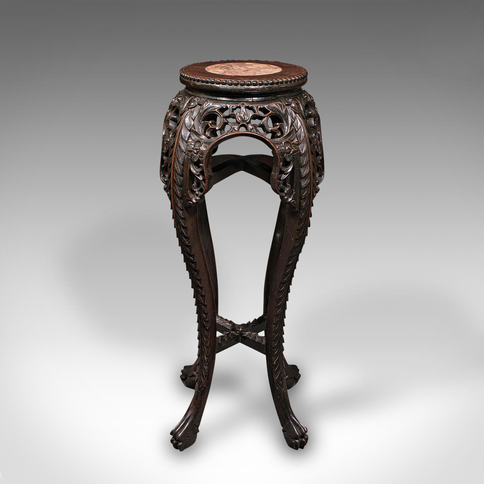 This is an antique jardiniere stand. A Chinese, rosewood and marble planter stand or lamp table, dating to the late Victorian period, circa 1900.

Strikingly carved appearance with an appealing marble top
Displays a desirable aged patina and in good