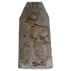 Panel de madera antiguo de Java, tallado a mano al estilo «wayang», que representa una figura de marioneta de sombras