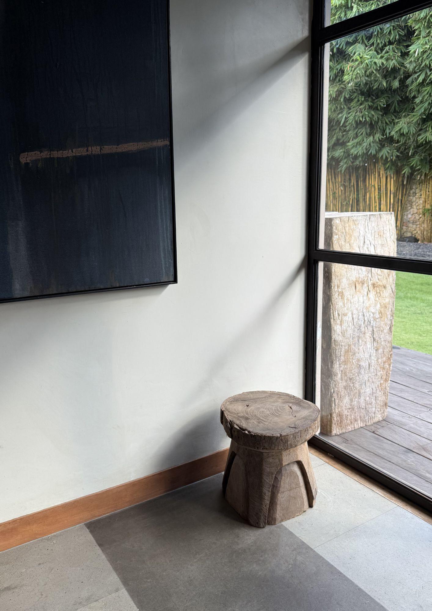 This versatile antique piece, handcrafted from solid teak wood in Java, Indonesia, functions beautifully as both a stool and a side table. Its compact, sturdy form is enriched by a wonderful age-related patina, highlighting decades of natural wear