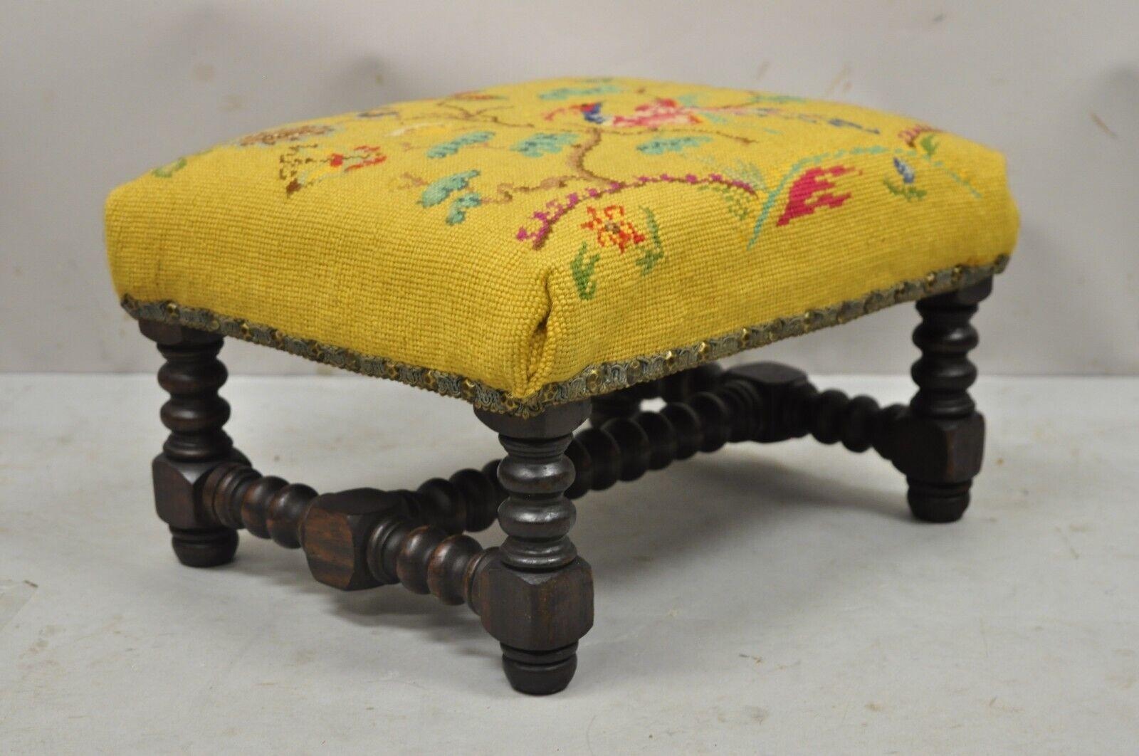 Antique Jenny Lind Turn Carved Walnut Needlepoint Small Footstool. Item features floral needlepoint seat with bird, turn carved walnut base, very nice antique item, label to underside reads 