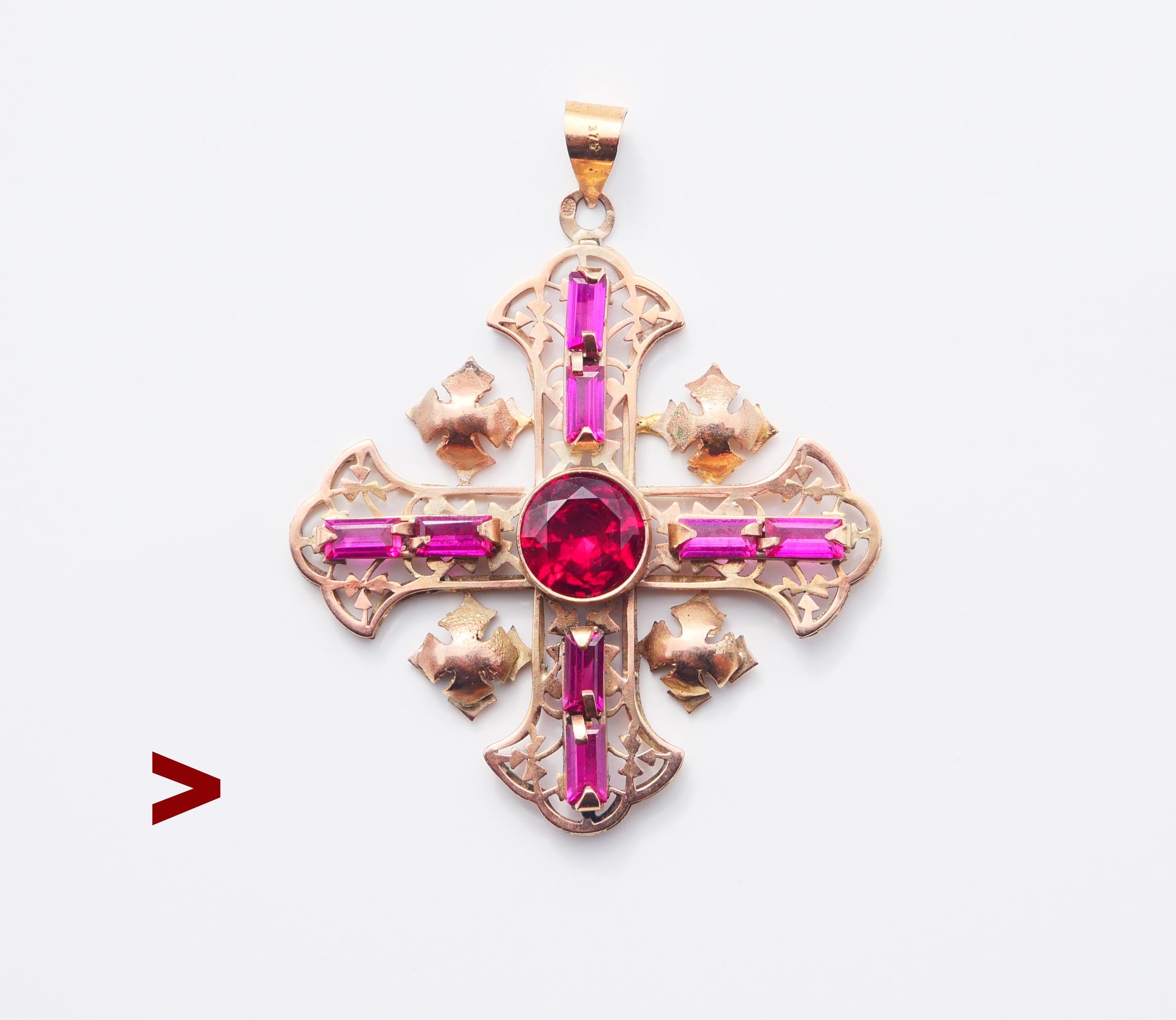 Antique European openwork Jerusalem crucifix pendant set with 9 Rubies. Exact origin unknown, hallmarked 375 on the bail and unknown hallmark on a suspension ring.

Cross measures  59 mm including the bail x 48 mm wide x 7 mm deep.

Rubies are lab