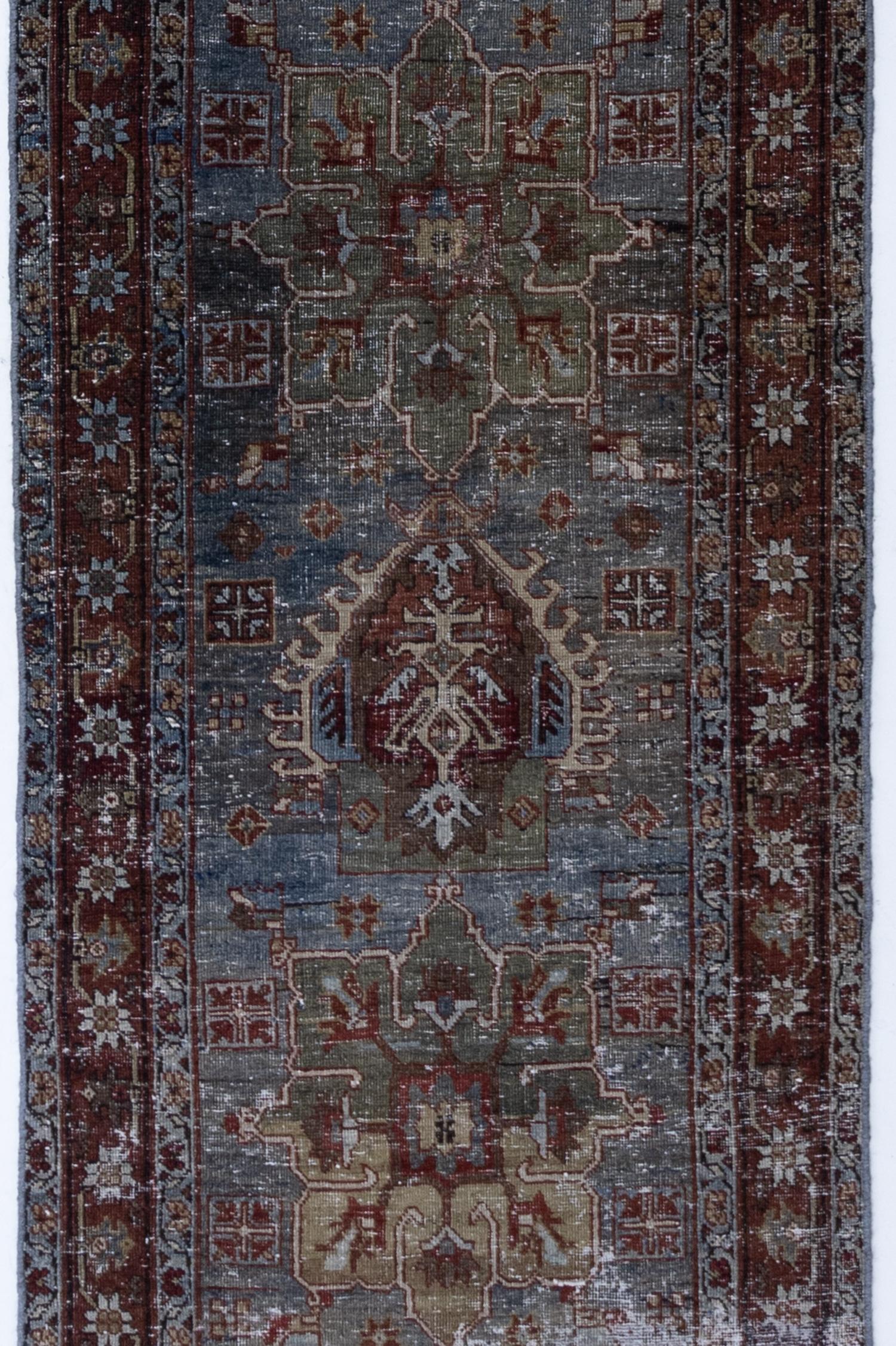 Colors: deep blue, crimson, green, gold

Pile: low

Antique Persian rug with moody jewel tones and beautiful distressing. Low pile with a study heavy weight feel that is safe for high traffic despite the distressing.

Wear Notes: 7

Wear