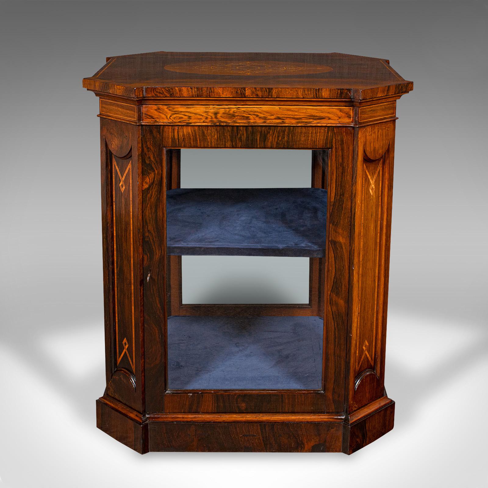 
This is an antique jeweller's display cabinet. An English, rosewood and glass shop retail case, dating to the Regency period, circa 1820.

Superb cabinetry in a fascinating form with fully glazed sides
Displays a desirable aged patina and in very