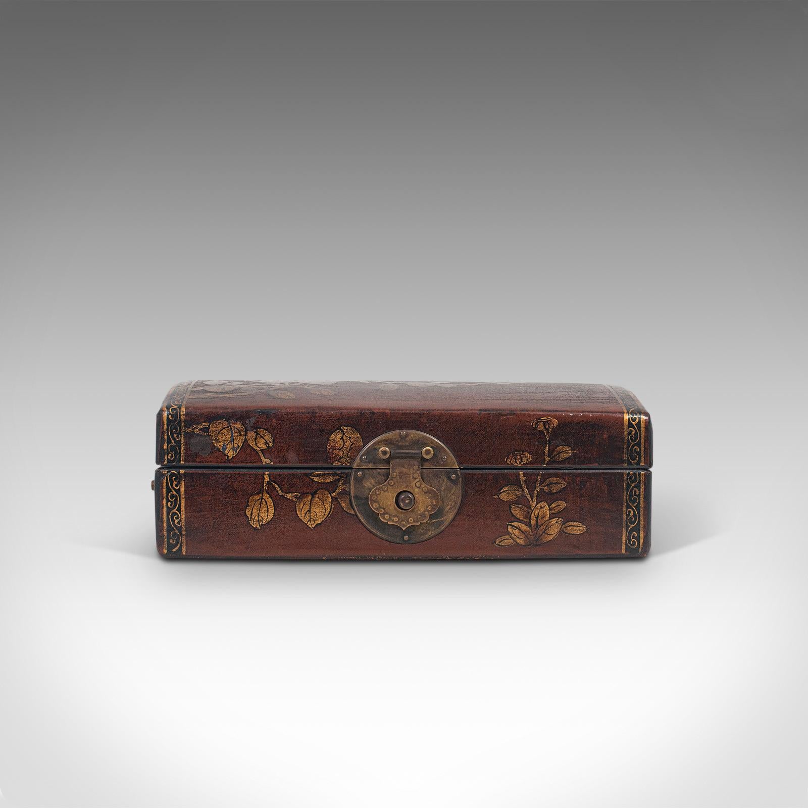 This is an antique jewelry box. A Japanese, leather bound desk caddy, dating to the Meiji period in the late 19th century, circa 1900.

Intriguing finish and dark tones
Displays a desirable aged patina, commensurate with age
Leather bound with