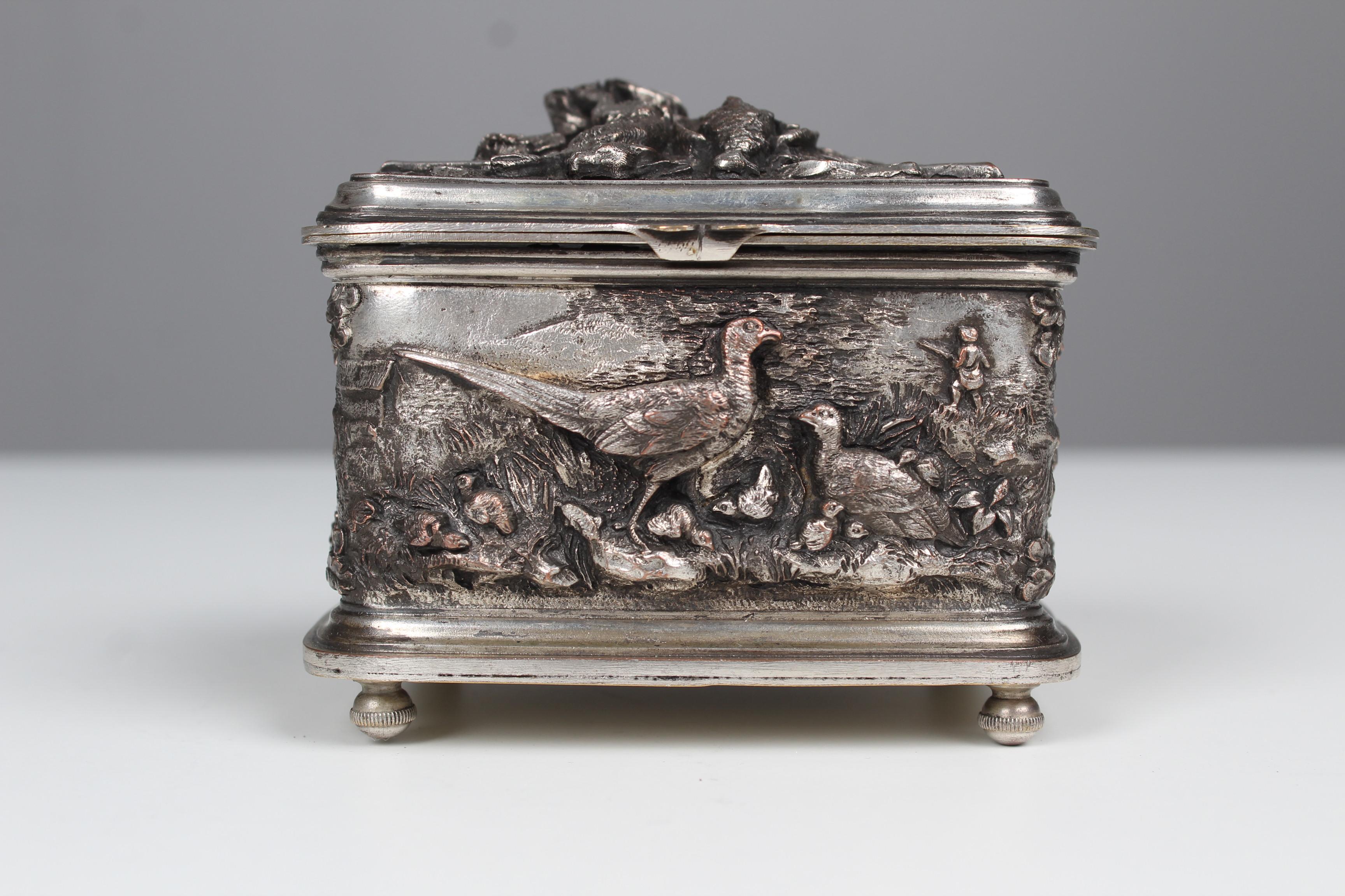 Exceptional antique jewelry box with fine depictions of hunting themes and forest animals.
Heavy iron work, silvered in a very good condition.
Lined with turquoise fabric in a good condition.
France, circa 1910.



