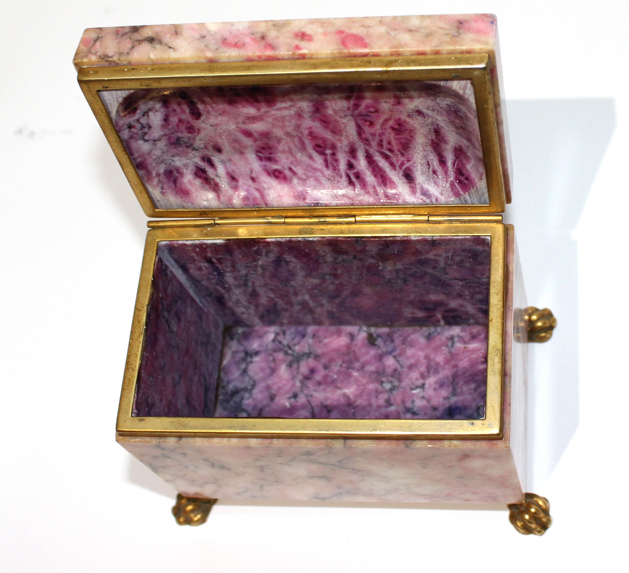 Antique jewelry casket with gold dore accent - ouside shades of pink, inside the stone-like material is scooped out on top, inlaid inside, and in shades of purple lilac.

Size of the box itself: 4