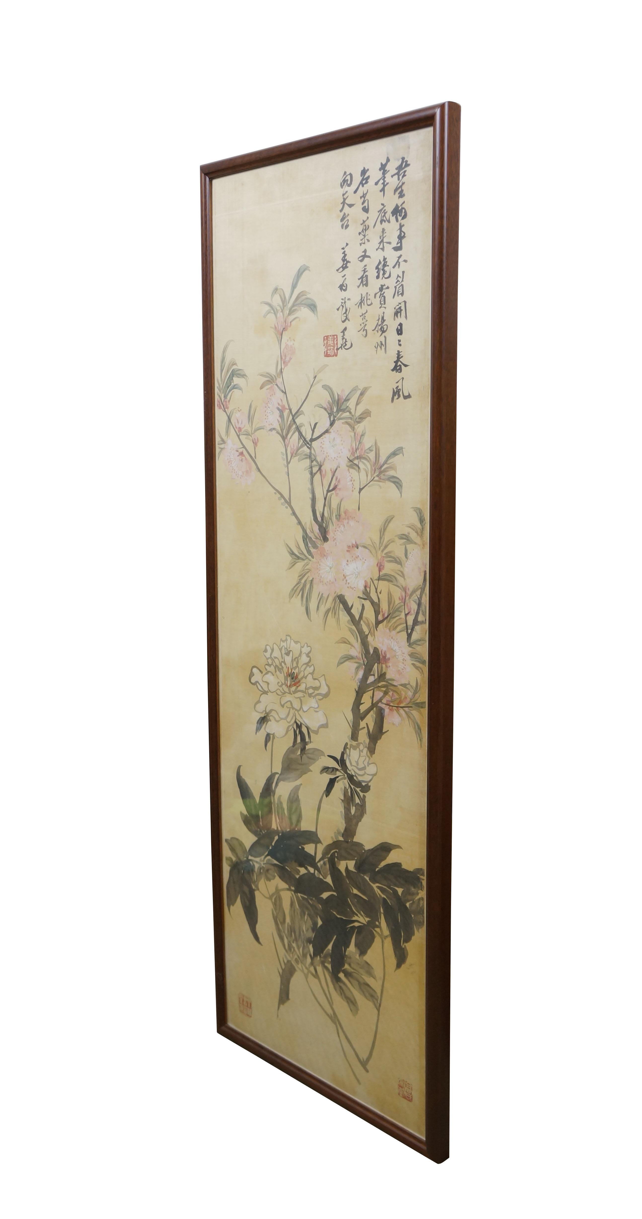 Circa early 20th century, Qing dynasty Jiang Jun Chinese chinoiserie watercolor scroll painting on silk showing branching stems of pink and white peonies and peach blossoms. Calligraphy in upper right. Three red stamps / seals. Wood frame.  

The