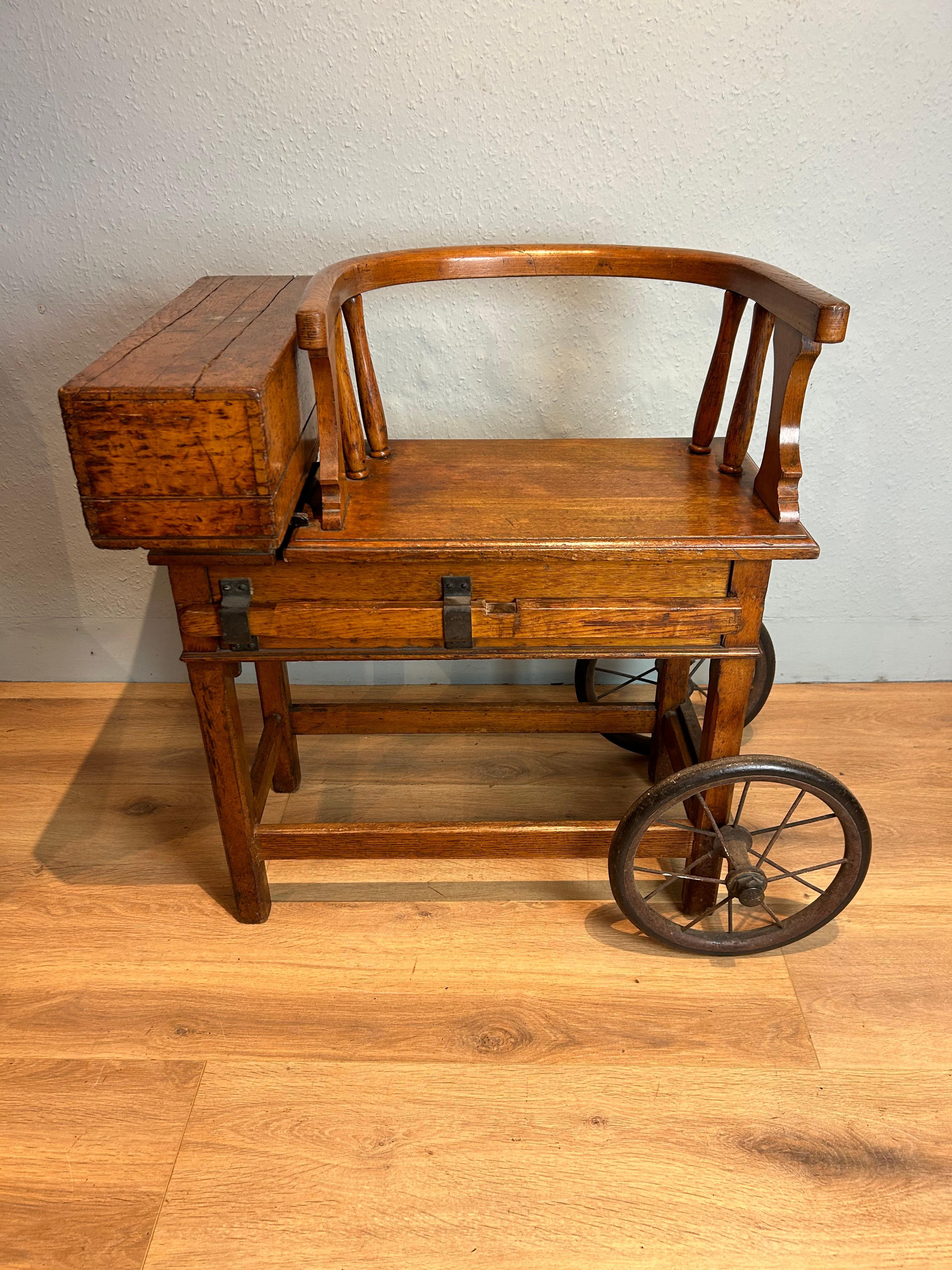 Edwardian jockey scales in oak by Avery with its original patina, there are shrinkage splits around the motif, a pleasant light honey colour.