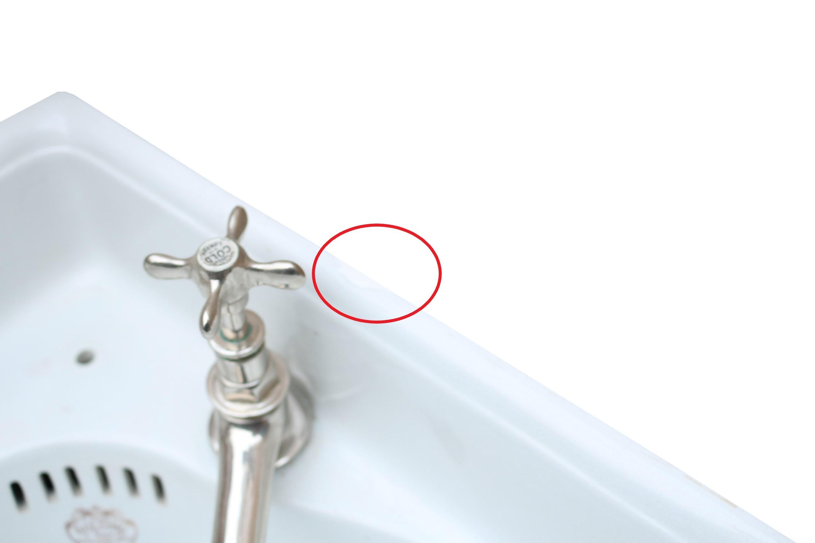The basin has no cracks, there is moderate crazing throughout with a small chip behind the right tap (as seen in photo) which will be mostly hidden by mastic once installed. Otherwise in excellent condition for its age.

The taps are not included