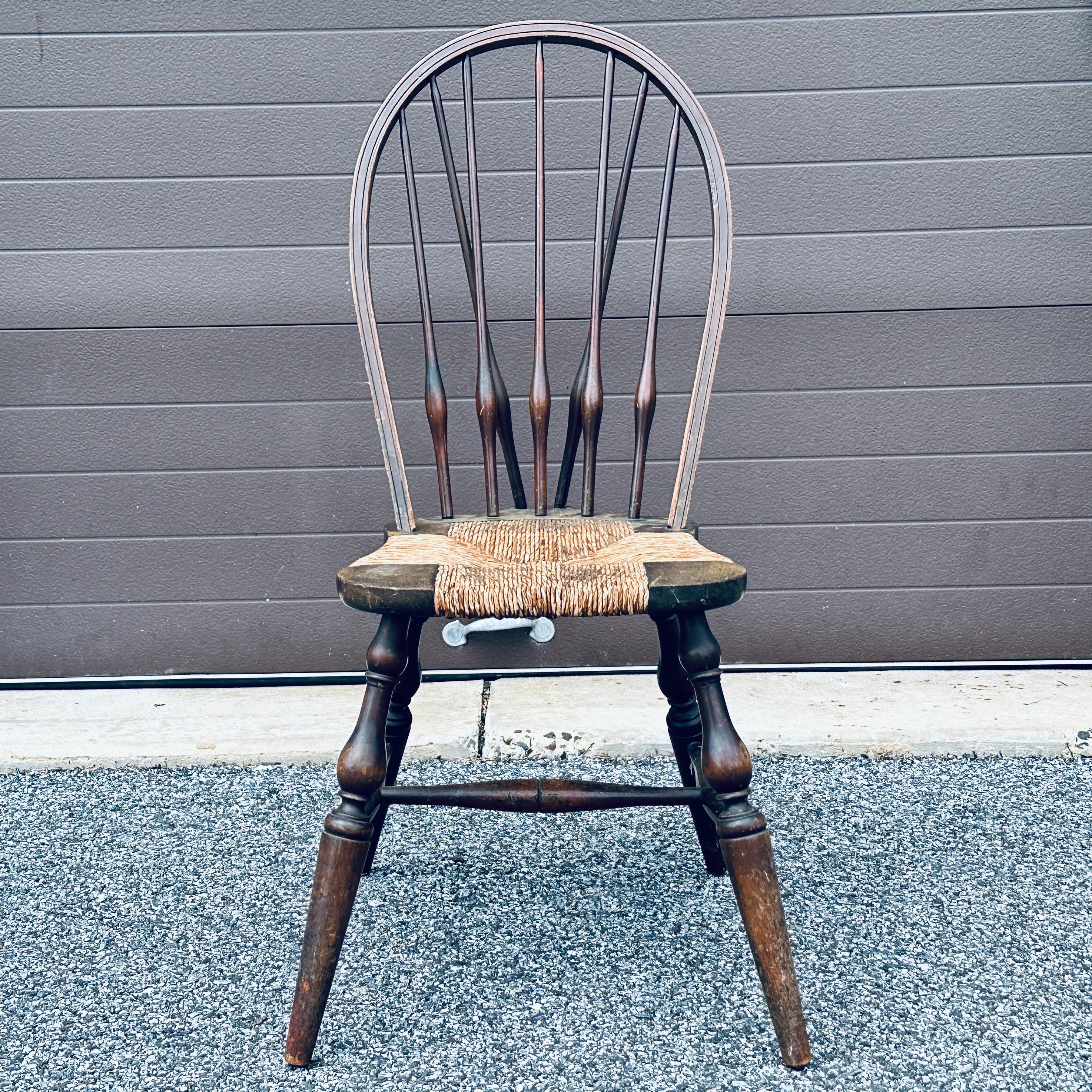 Antique hand made brace back rush seat Windsor chair by John Wanamaker Fine Furniture New York. Tagged underneath with metal badge. 