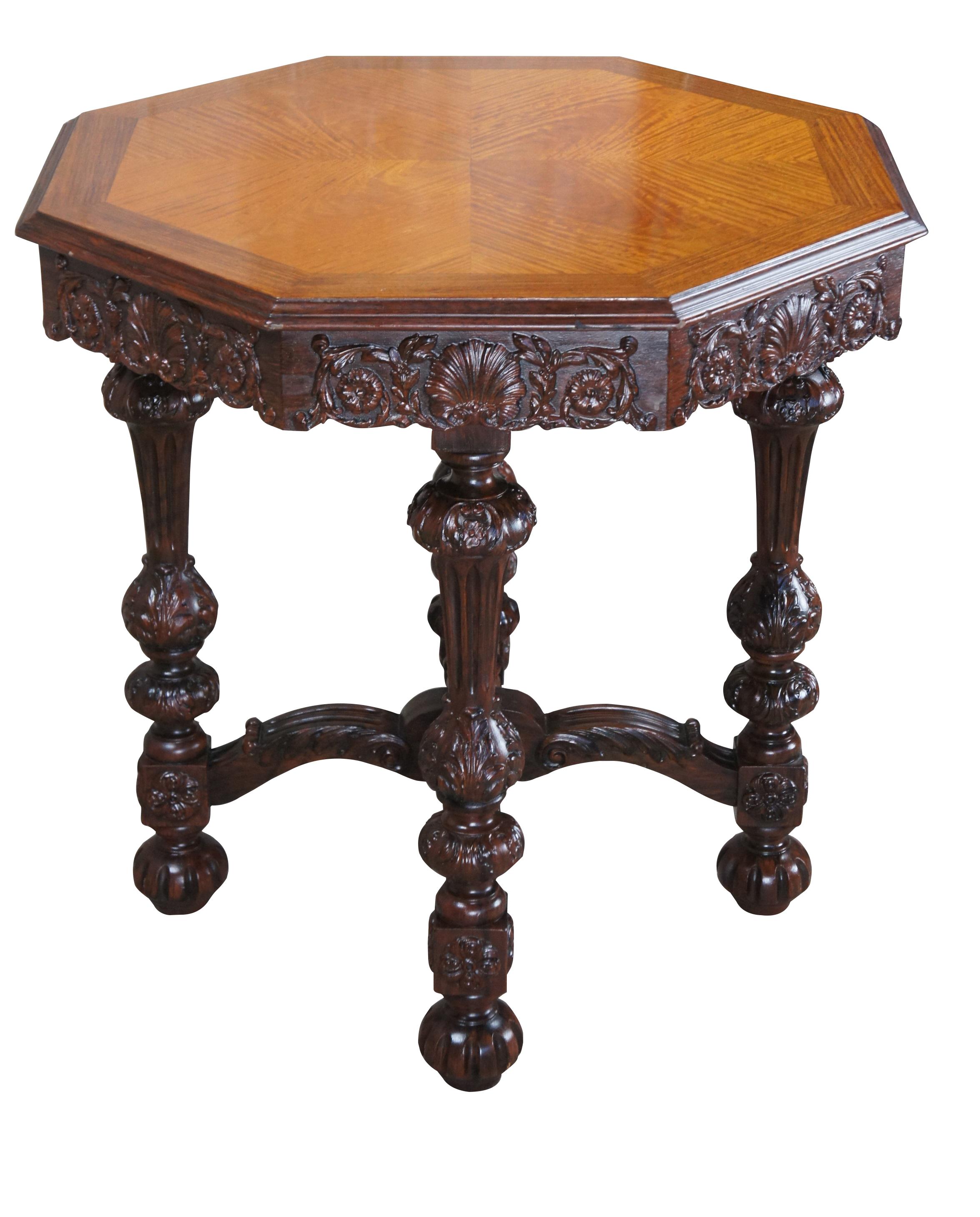 An impressive Octagonal center or side table by Johnson Hadley Johnson, circa 1930s.  Made from walnut with a matchbook veneered satinwood top.  Drawing insipration from French and Italian Baroque styling.  Features a scalloped carved and foliate
