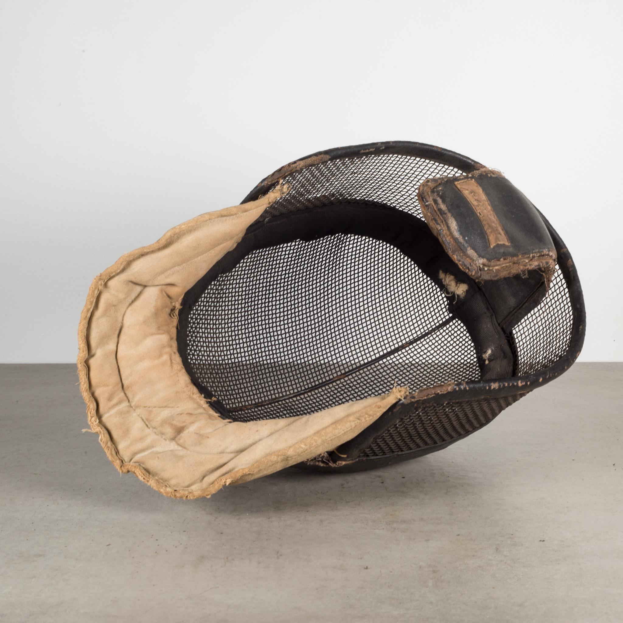 About

An original vintage fencing mask from Joseph Vince. The main body is a steel frame with wire meshing and fabric padding. The padding is held onto the body of the mask by wrapping around the wire. The leather and wire have retained most of