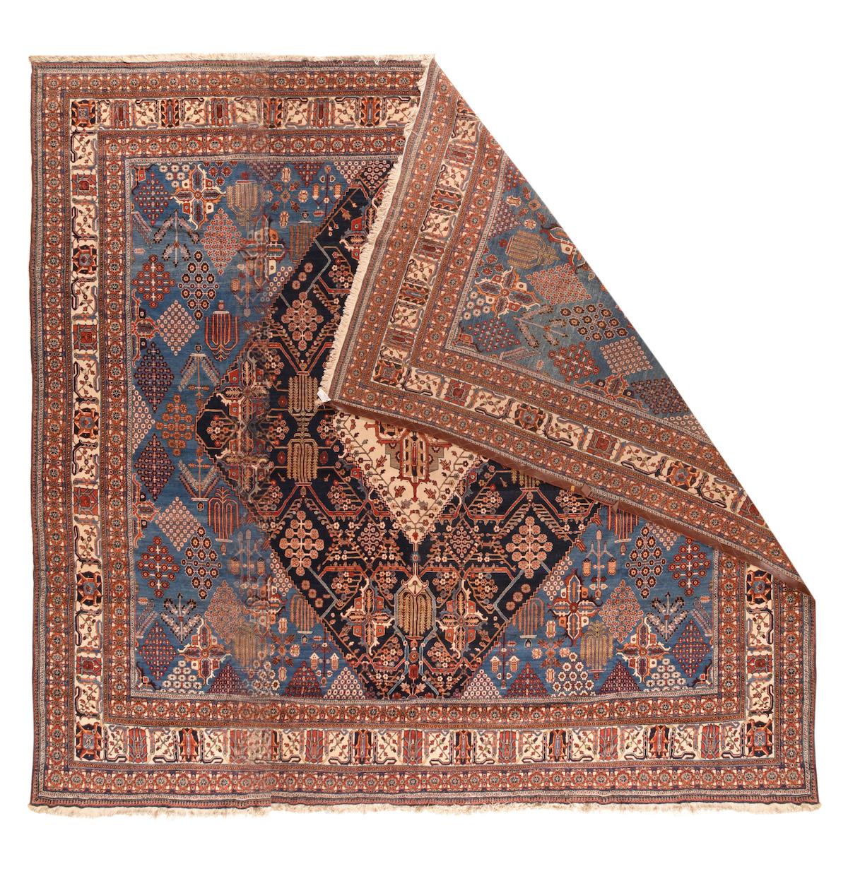 Antique Joshaghan Rug 15'2'' x 15'8''. In the uniquely characteristic Joshagan style, but in a rare format, with a cerulean field supporting a navy sub-field, both with uniformly lozengoidal weeping willows, floret arrays and cruciform motives.