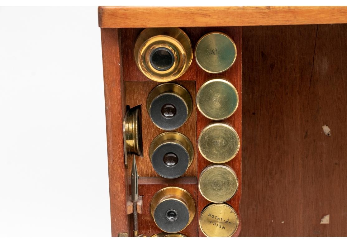 Antique microscope. This J. Swift & Son antique large presentation challenge brass binocular microscope was made between 1881-1910, most likely between 1890 and 1905. The microscope itself is bent (that is the style). Swift tripod stand in lacquered