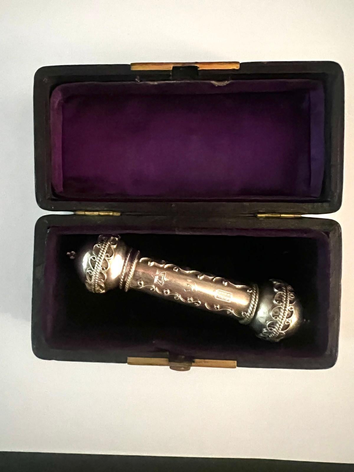 This is an outstanding and extremely rare hand crafted, solid sterling silver Mezuzah in the original leather and dark purple velvet box.
It was made in Vienna, Austria between 1890 and 1900 by an Artisan. Engraved on the Mezuzah is a Star of David,