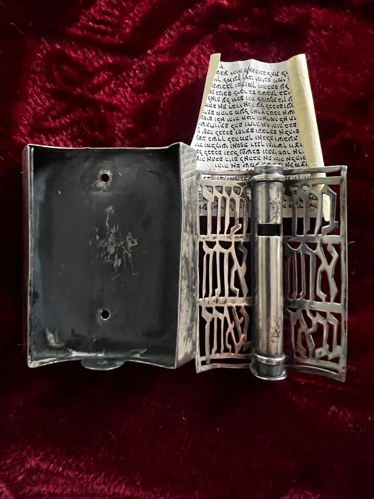 “You shall be blessed when you come, and you shall be blessed when you depart “- translated Hebrew lettering engraved on the front.
This is an incredibly intricate hand crafted 925 sterling silver mezuzah which consists of two parts and ready to be