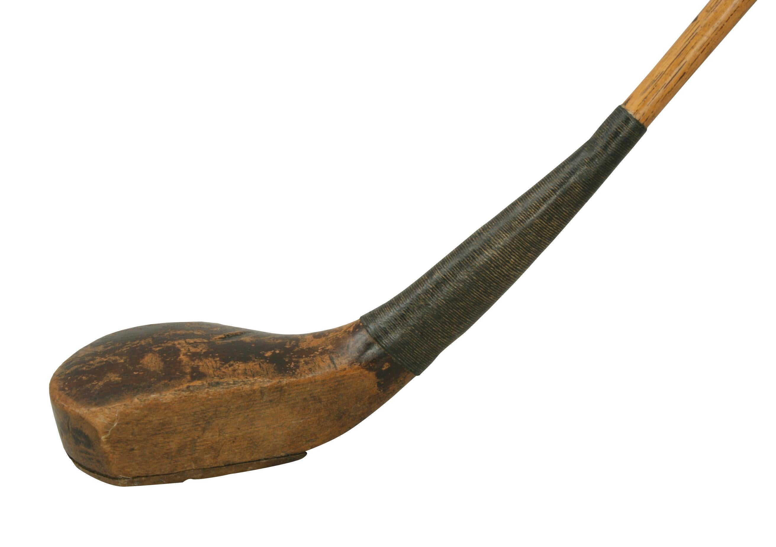 Antique Hickory golf club, scared head driver.
A juniors scared head, spliced wood driver. The golf club with hickory shaft and sheep skin grip. The head with horn sole insert and lead weight to the rear with faint makers name 'HEALEY'. A very nice