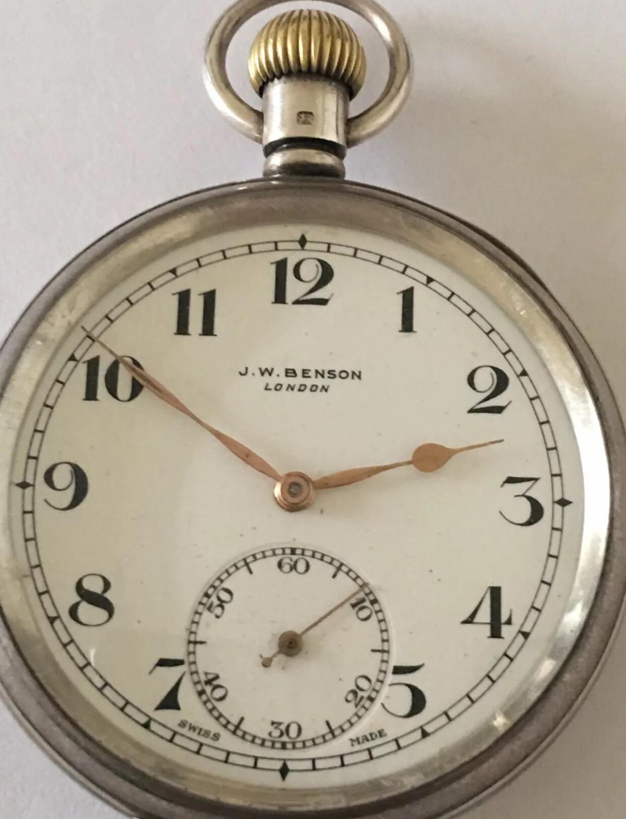 Antique J.W. Benson London Silver Pocket Watch.

This silver English pocket watch is working and ticking nicely. There is a visible dot dent on the back cover as shown on the photo. 
Please study the images carefully as form part of the description.