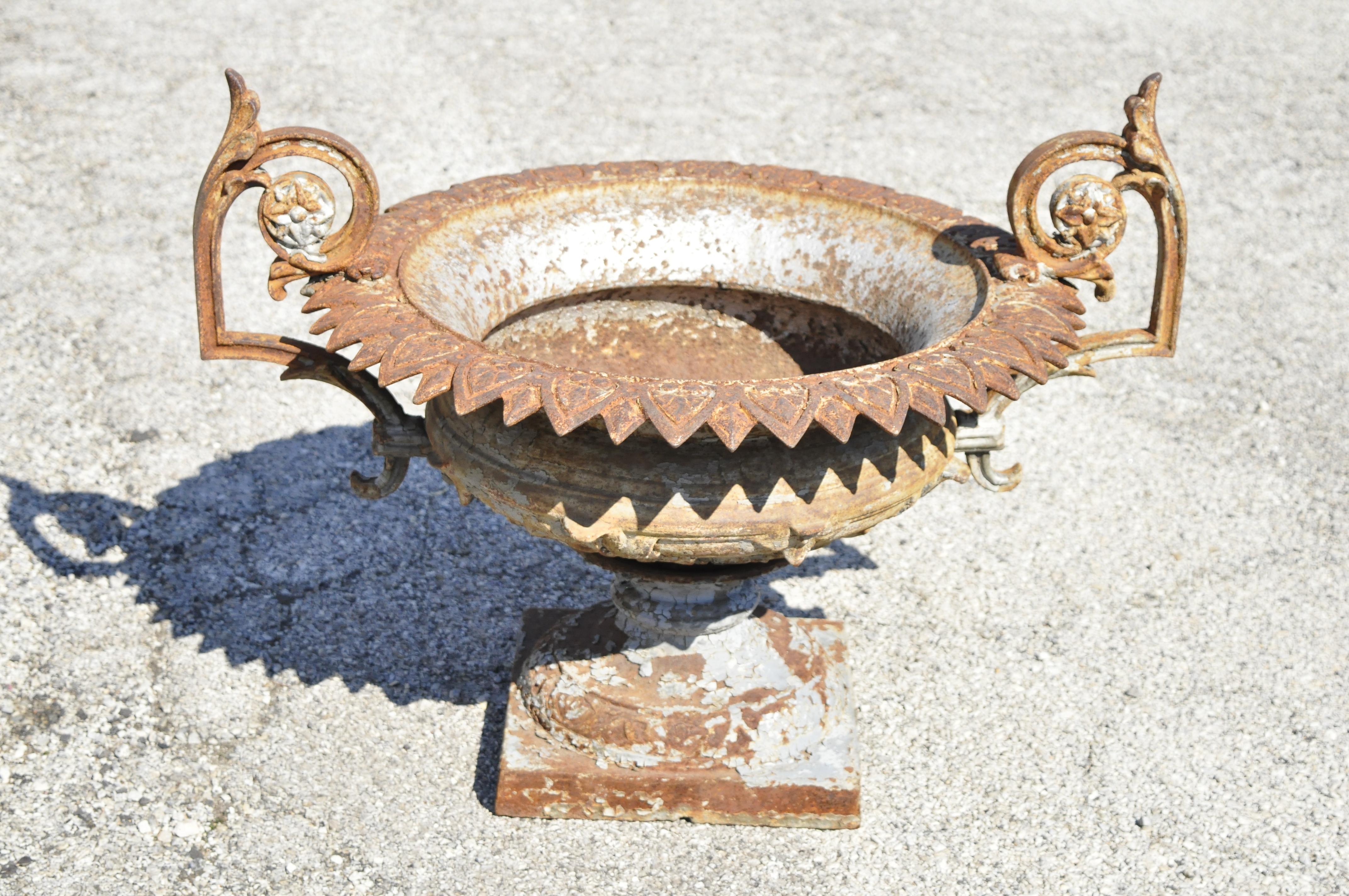 Antique J.W. Fiske attr. French cast iron urn garden planter with twin handles. Item features original weathered/distressed finish, leafy edges, ornate handles, cast iron construction, very nice antique item, great style and form. Attributed to J.W.