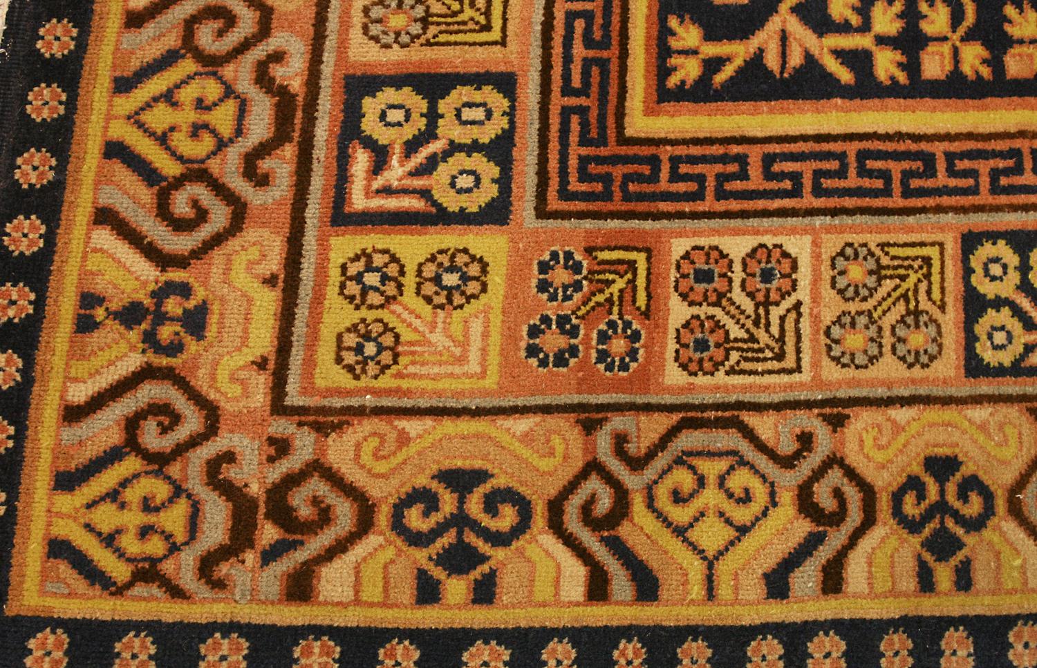 This is an antique Khotan rug woven in eastern Turkistan during the first quarter of the 20th century circa 1920's and measures 655 x 190 CM. At each end of the rug, there are two vases located in the main fields which give life to two pomegranate