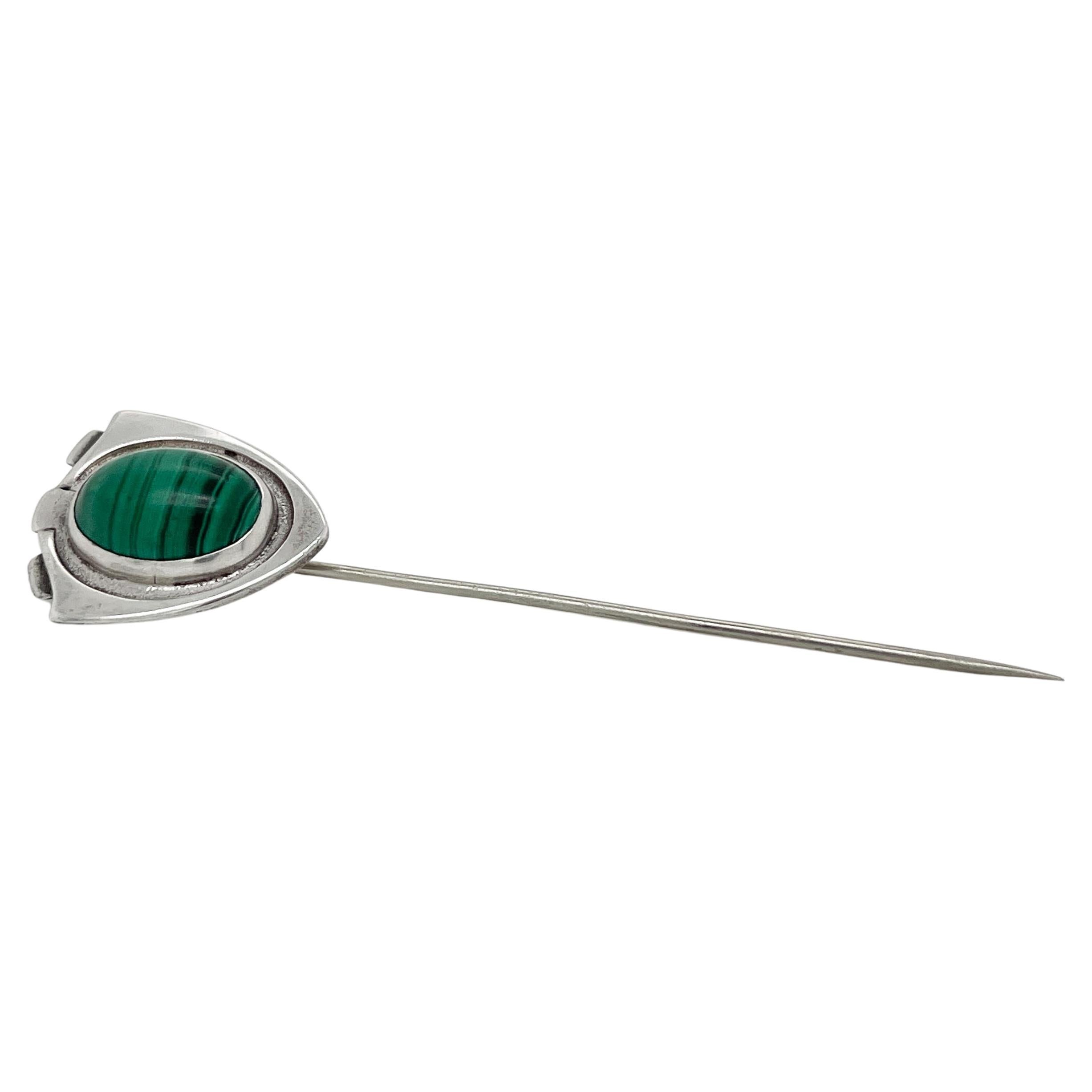 A fine American Arts & Crafts stick pin

In sterling silver & set with a malachite shaped cabochon set on a shield-shaped top.

By the Kalo Workshops.

Simply an amazing American Arts & Crafts period studio piece! 

Date:
circa 1900

Overall